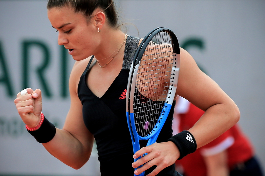 epa09245234 Maria Sakkari of Greece in action against Jasmine Paolini of Italy during their second round match at the French Open tennis tournament at Roland Garros in Paris, France, 03 June 2021.  EPA