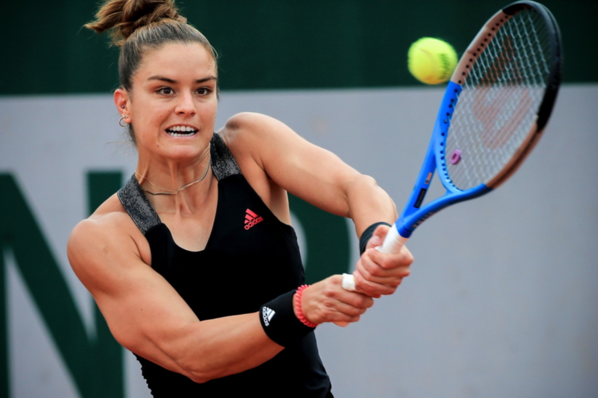 epa09245235 Maria Sakkari of Greece in action against Jasmine Paolini of Italy during their second round match at the French Open tennis tournament at Roland Garros in Paris, France, 03 June 2021.  EPA