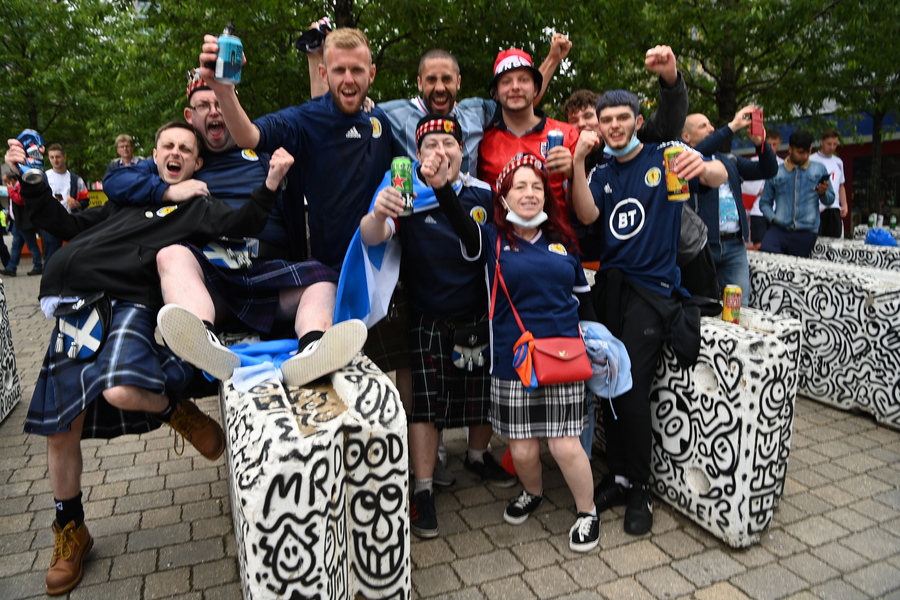 epa09283541 English and Scottish fans outside the Wembley Stadium ahead of the UEFA EURO 2020 group D preliminary round soccer match between England and Scotland in London, Britain, 18 June 2021.  EPA