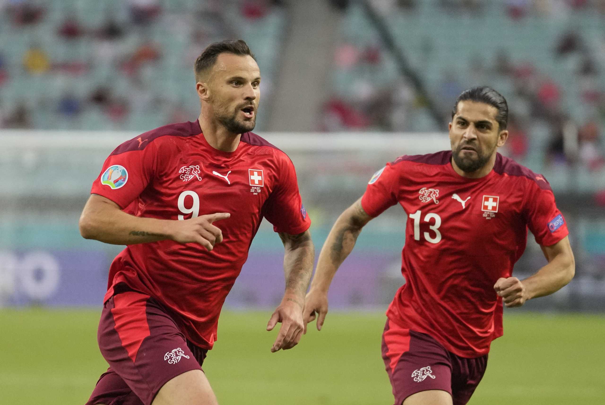 Soccer Football - Euro 2020 - Group A - Switzerland v Turkey - Baku Olympic Stadium, Baku, Azerbaijan - June 20, 2021 Switzerland's Haris Seferovic celebrates scoring their first goal with Ricardo Rodriguez Pool via REUTERS