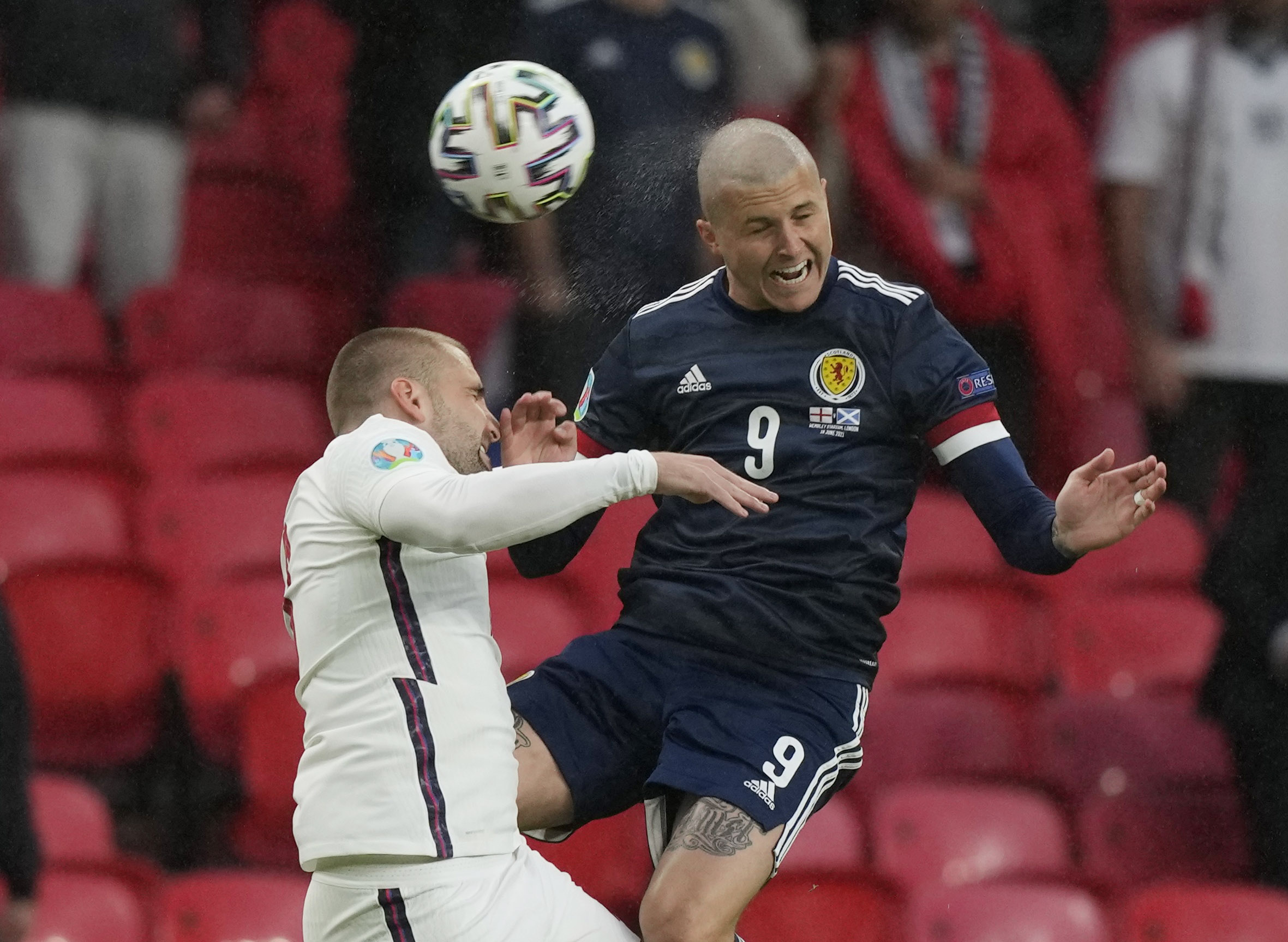 Soccer Football - Euro 2020 - Group D - England v Scotland - Wembley Stadium, London, Britain - June 18, 2021 England's Luke Shaw in action with Scotland's Lyndon Dykes Pool via REUTERS