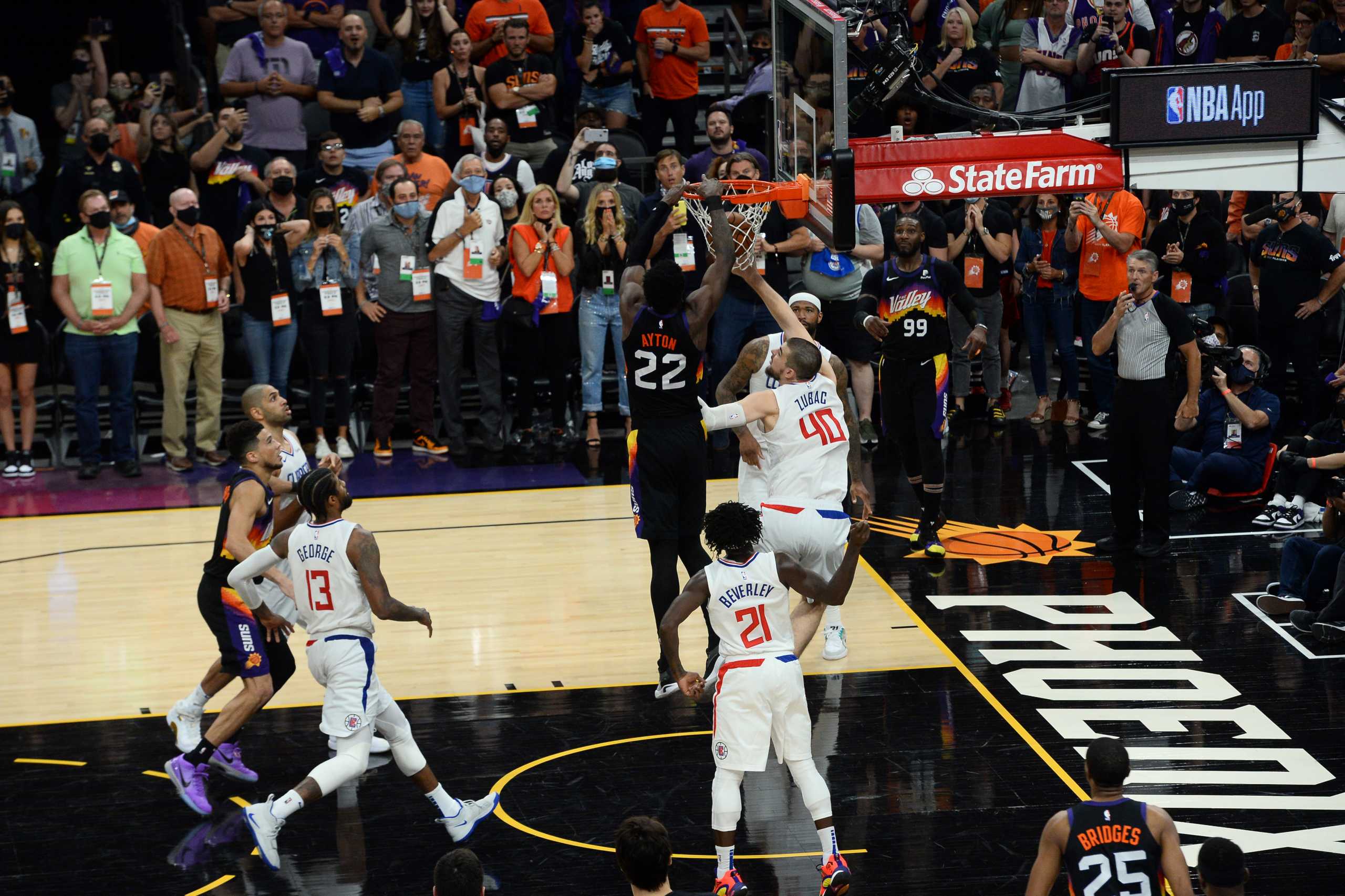 Jun 22, 2021; Phoenix, Arizona, USA; Phoenix Suns center Deandre Ayton (22) dunks over LA Clippers center Ivica Zubac (40) in the final second during the second half of game two of the Western Conference Finals for the 2021 NBA Playoffs at Phoenix Suns Arena. Mandatory Credit: Joe Camporeale-USA TODAY Sports