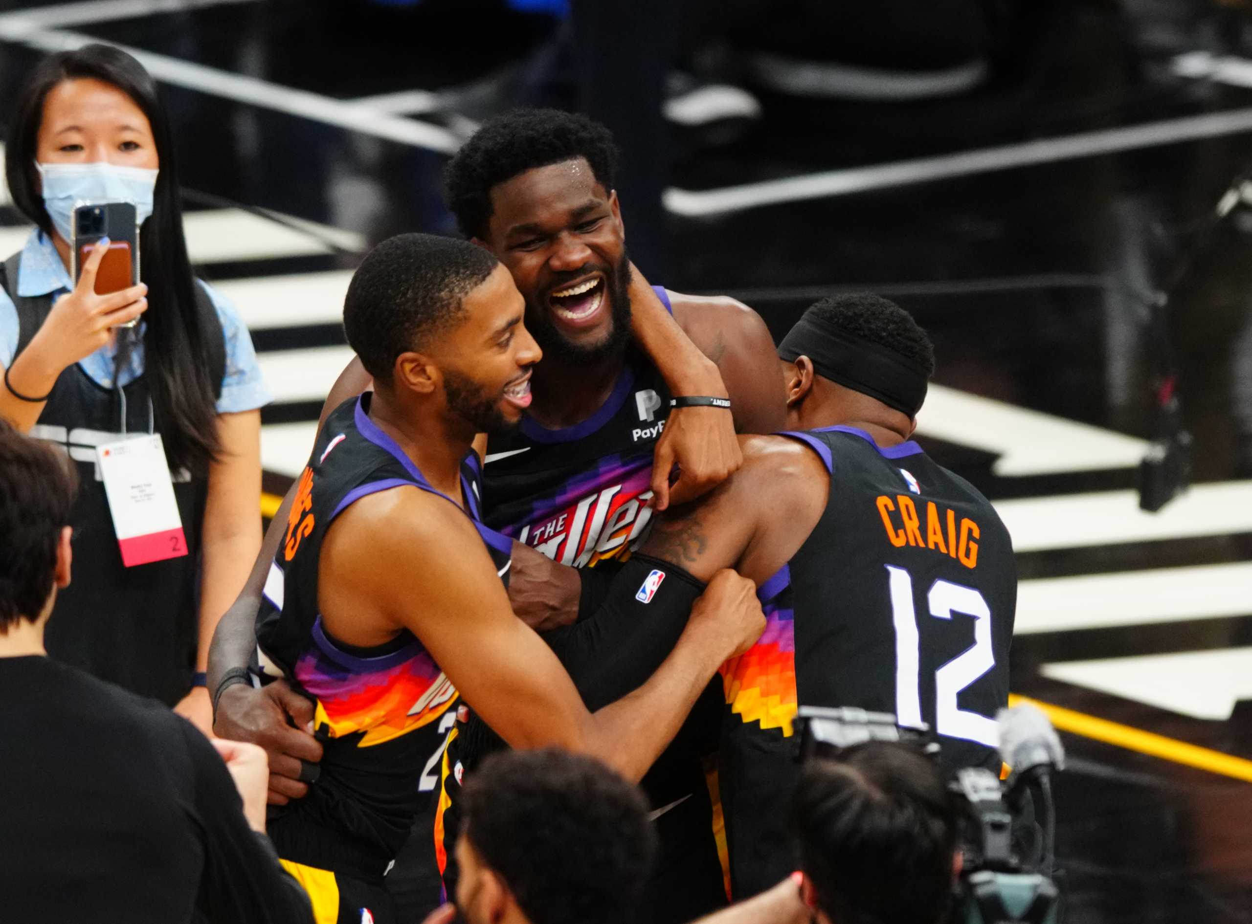Jun 22, 2021; Phoenix, Arizona, USA; Phoenix Suns center Deandre Ayton (22) celebrates with teammates after scoring the game winning shot against the Los Angeles Clippers in the second half during game two of the Western Conference Finals for the 2021 NBA Playoffs at Phoenix Suns Arena. Mandatory Credit: Mark J. Rebilas-USA TODAY Sports