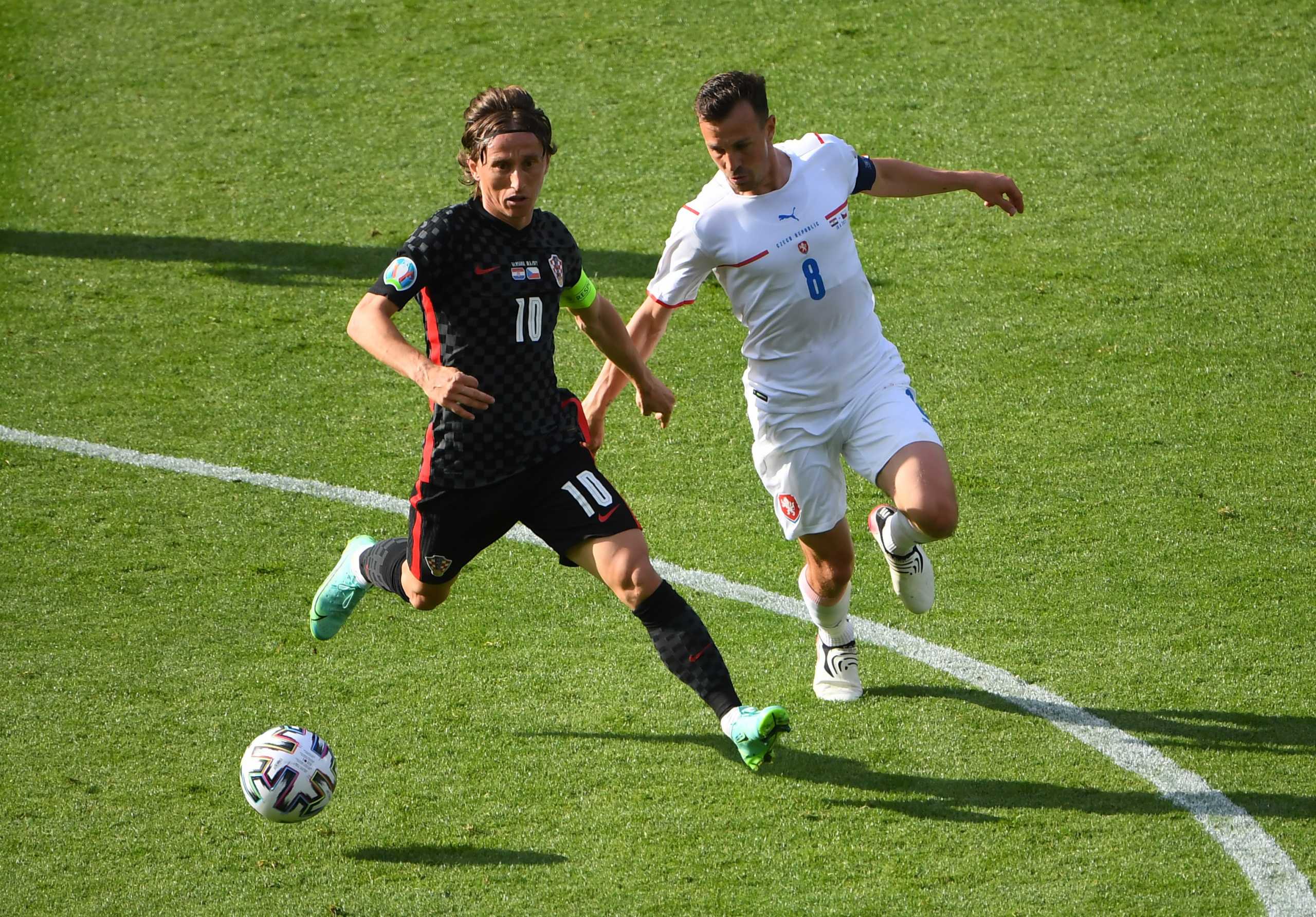 Soccer Football - Euro 2020 - Group D - Croatia v Czech Republic - Hampden Park, Glasgow, Scotland, Britain - June 18, 2021 Croatia's Luka Modric in action with Czech Republic's Vladimir Darida Pool via REUTERS