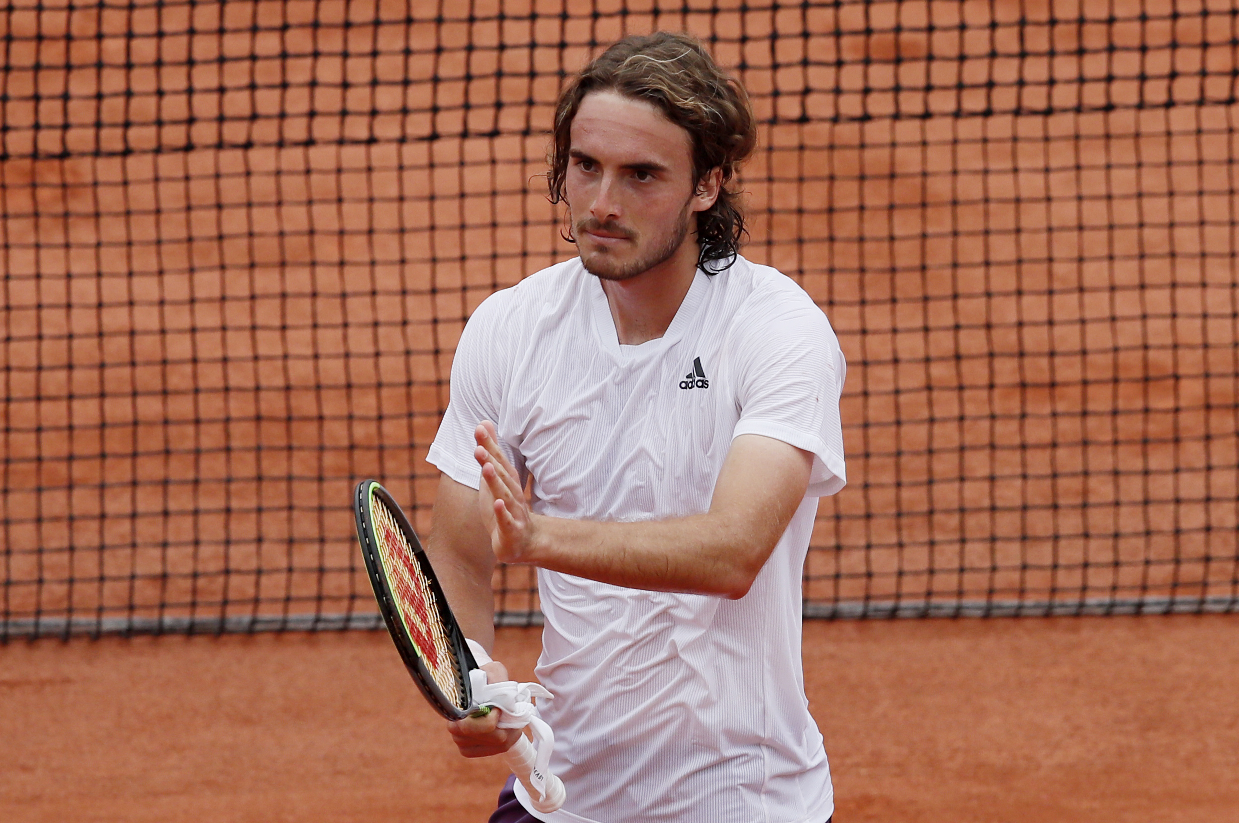 Tennis - French Open - Roland Garros, Paris, France - June 2, 2021 Greece's Stefanos Tsitsipas celebrates winning his second round match against Spain's Pedro Martínez REUTERS