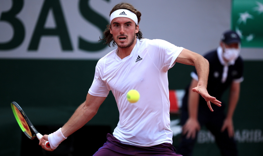 epa09243446 Stefanos Tsitsipas of Greece in action during the 2nd round match against Pedro Martinez of Spain at the French Open tennis tournament at Roland Garros in Paris, France, 02 June 2021.  EPA