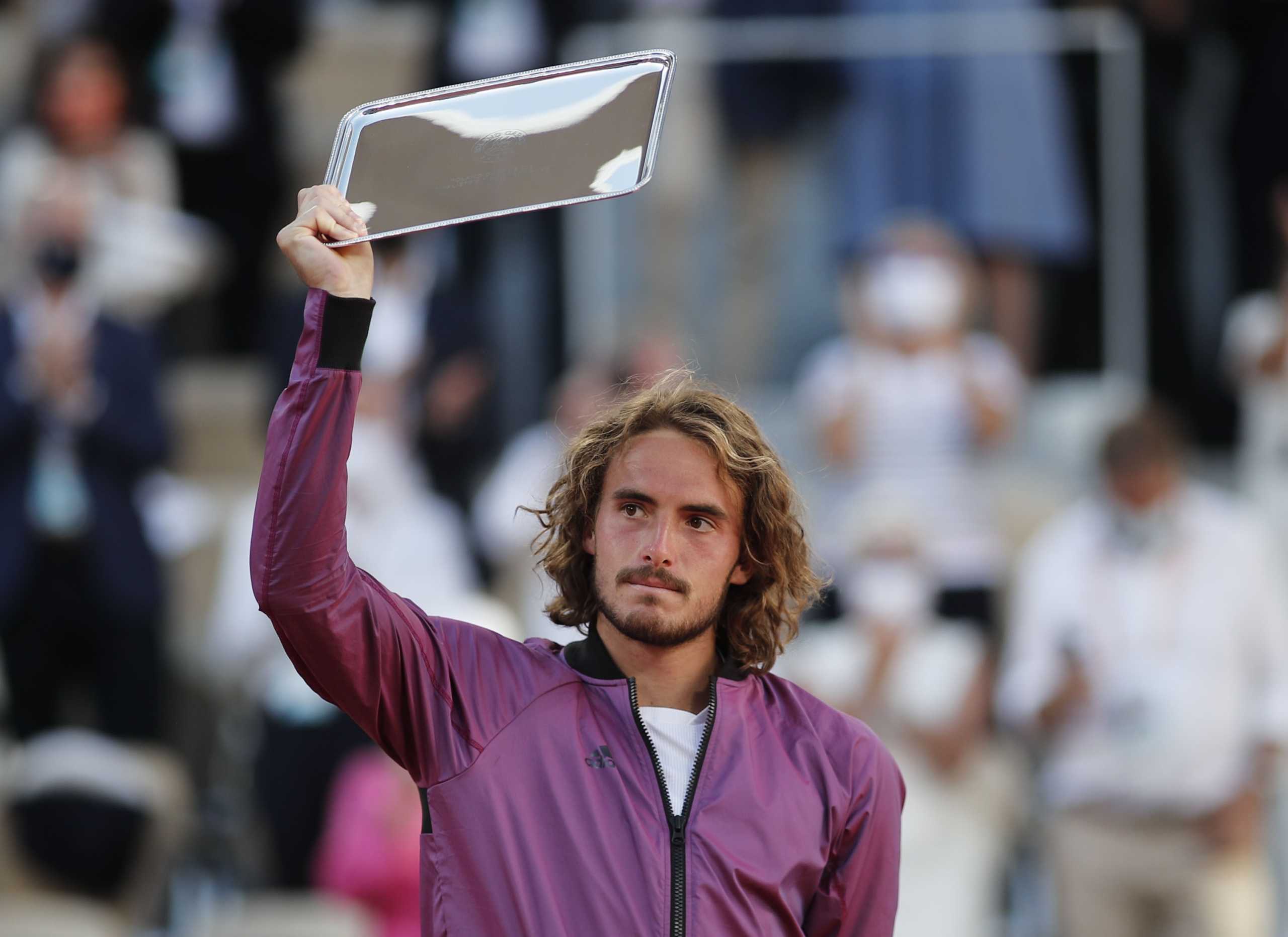 Tennis - French Open - Roland Garros, Paris, France - June 13, 2021 Greece's Stefanos Tsitsipas poses with the runners up trophy after losing the final against Serbia's Novak Djokovic REUTERS