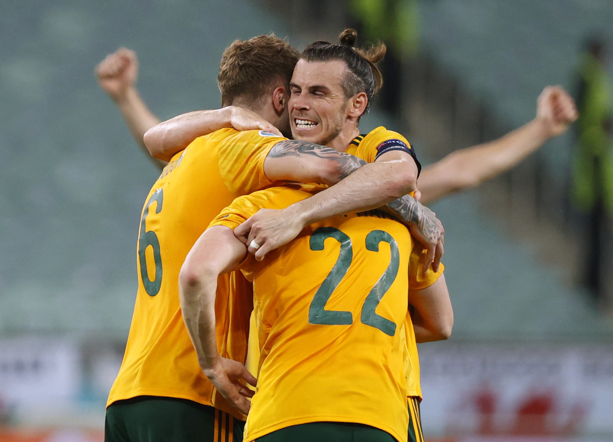 Soccer Football - Euro 2020 - Group A - Turkey v Wales - Baku Olympic Stadium, Baku, Azerbaijan - June 16, 2021 Wales' Gareth Bale celebrates with Joe Rodon and Chris Mepham after the match Pool via REUTERS