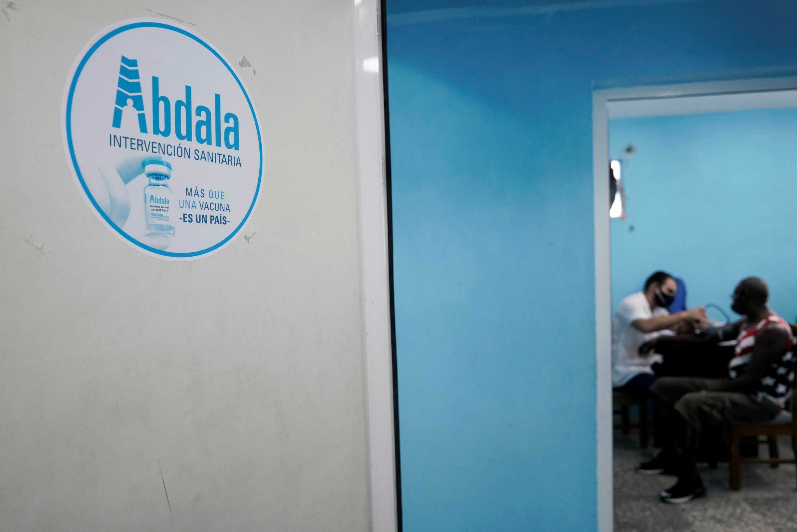 A man has his blood pressure taken before being vaccinated at a vaccination center amid concerns about the spread of the coronavirus disease (COVID-19), in Havana, Cuba, June 17, 2021. REUTERS