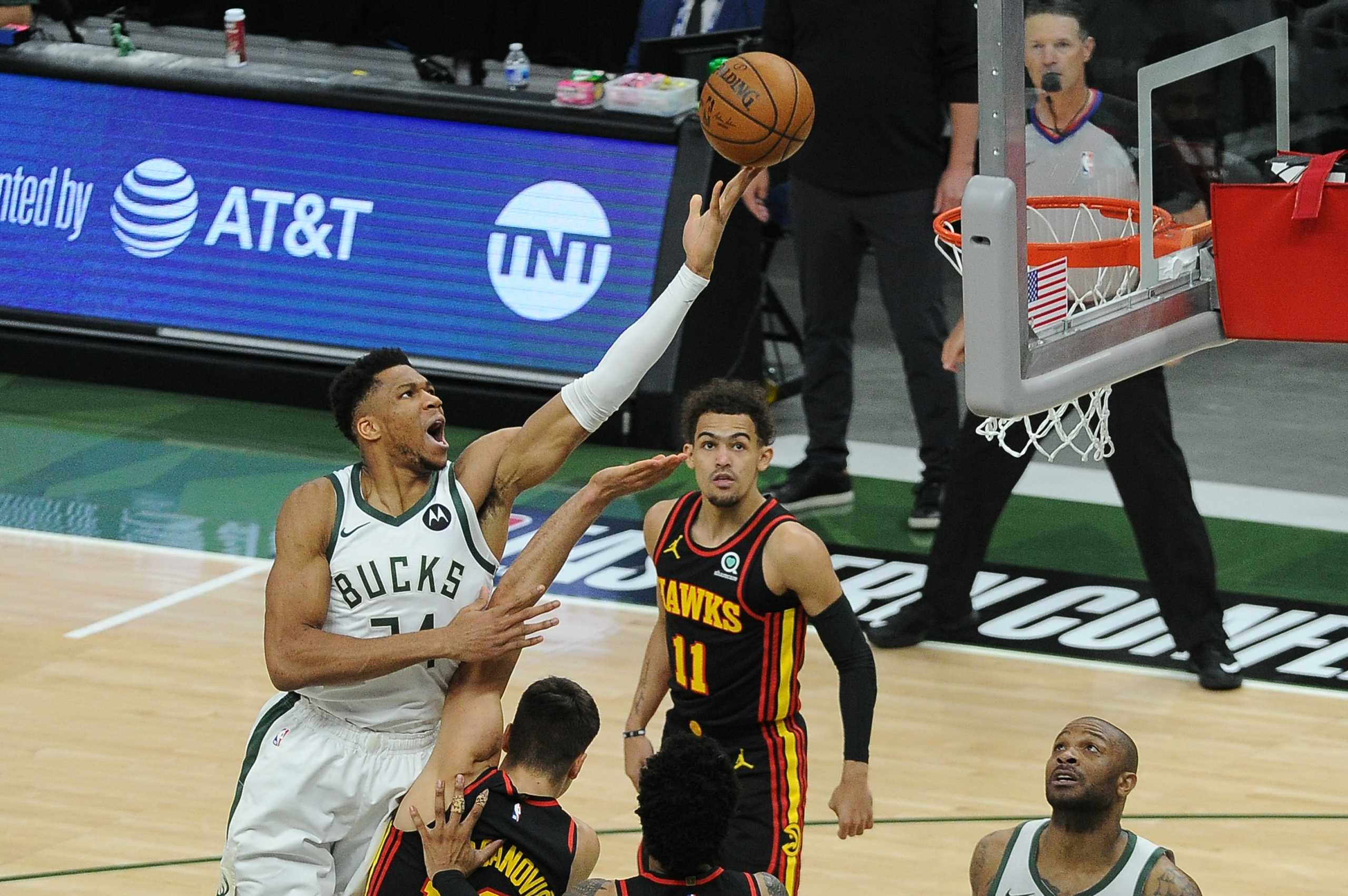 Jun 25, 2021; Milwaukee, Wisconsin, USA; Milwaukee Bucks forward Giannis Antetokounmpo (34) shoots the ball over Atlanta Hawks guard Bogdan Bogdanovic (13) in the first quarter during game two of the Eastern Conference Finals for the 2021 NBA Playoffs at Fiserv Forum. Mandatory Credit: Michael McLoone-USA TODAY Sports