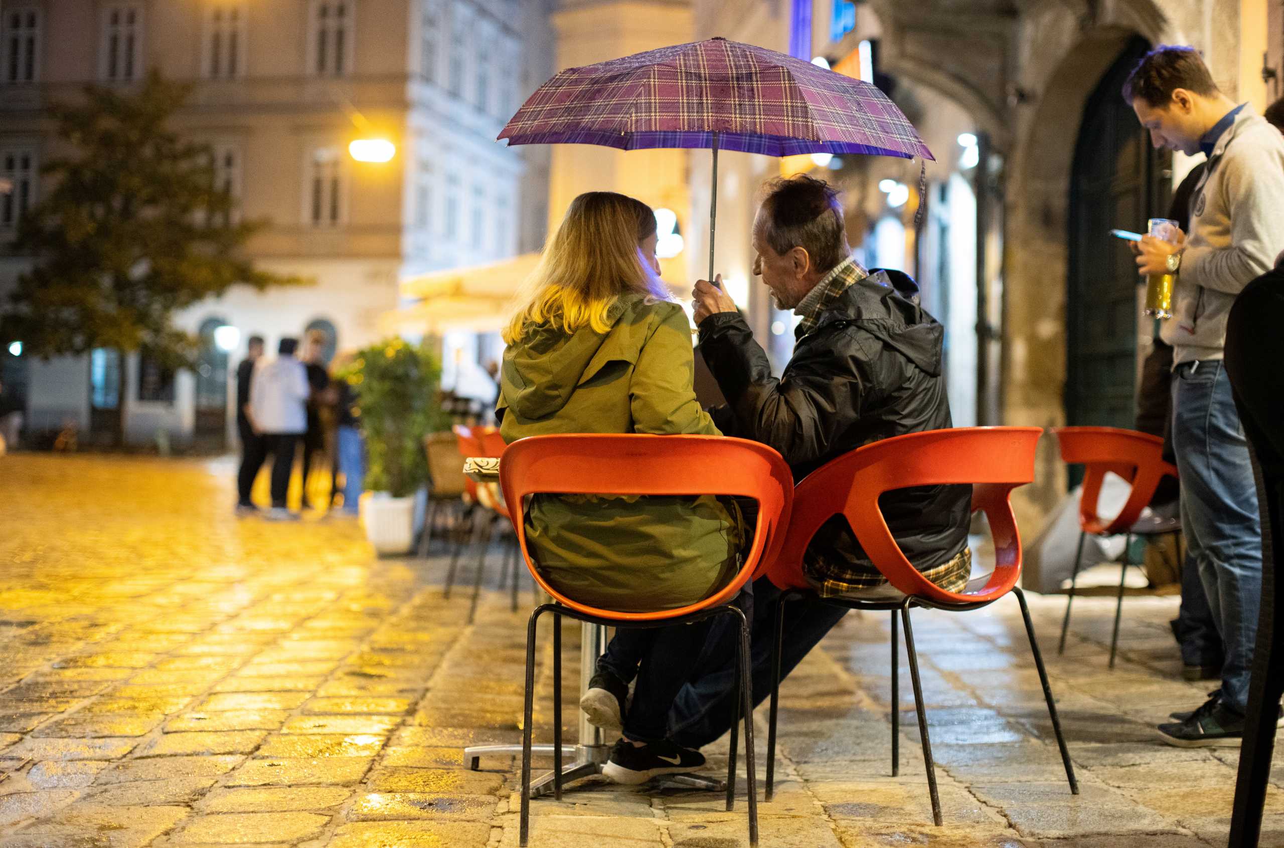 People enjoy an evening drink at Bermuda Triangle as cafes, bars and restaurants reopen after closing down for months amid the coronavirus disease (COVID-19) outbreak in Vienna, Austria, May 19, 2021. REUTERS