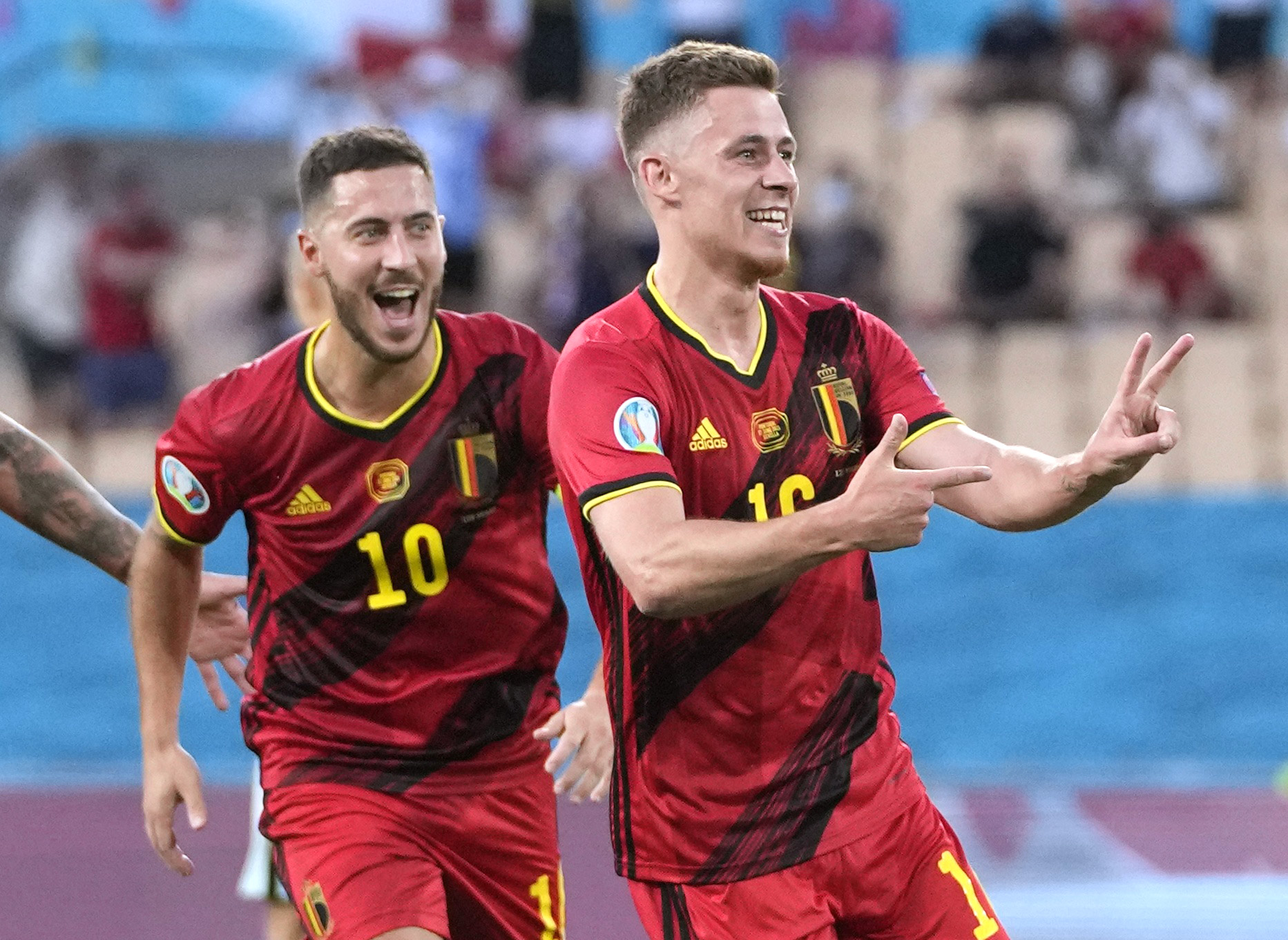 Soccer Football - Euro 2020 - Round of 16 - Belgium v Portugal - La Cartuja Stadium, Seville, Spain - June 27, 2021  Belgium's Thorgan Hazard celebrates scoring their first goal with Eden Hazard Pool via REUTERS