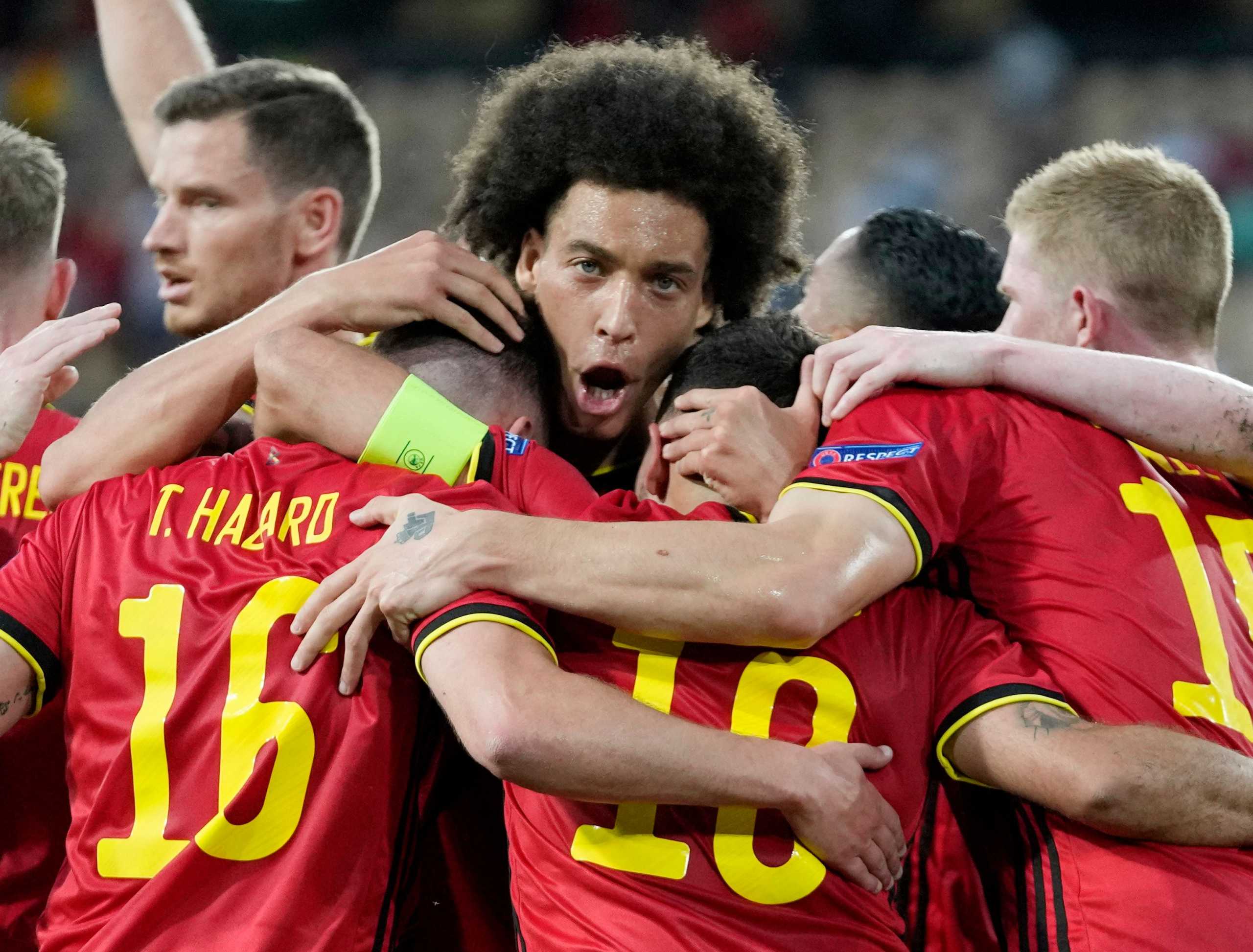 Soccer Football - Euro 2020 - Round of 16 - Belgium v Portugal - La Cartuja Stadium, Seville, Spain - June 27, 2021  Belgium's Thorgan Hazard celebrates scoring their first goal with teammates Pool via REUTERS