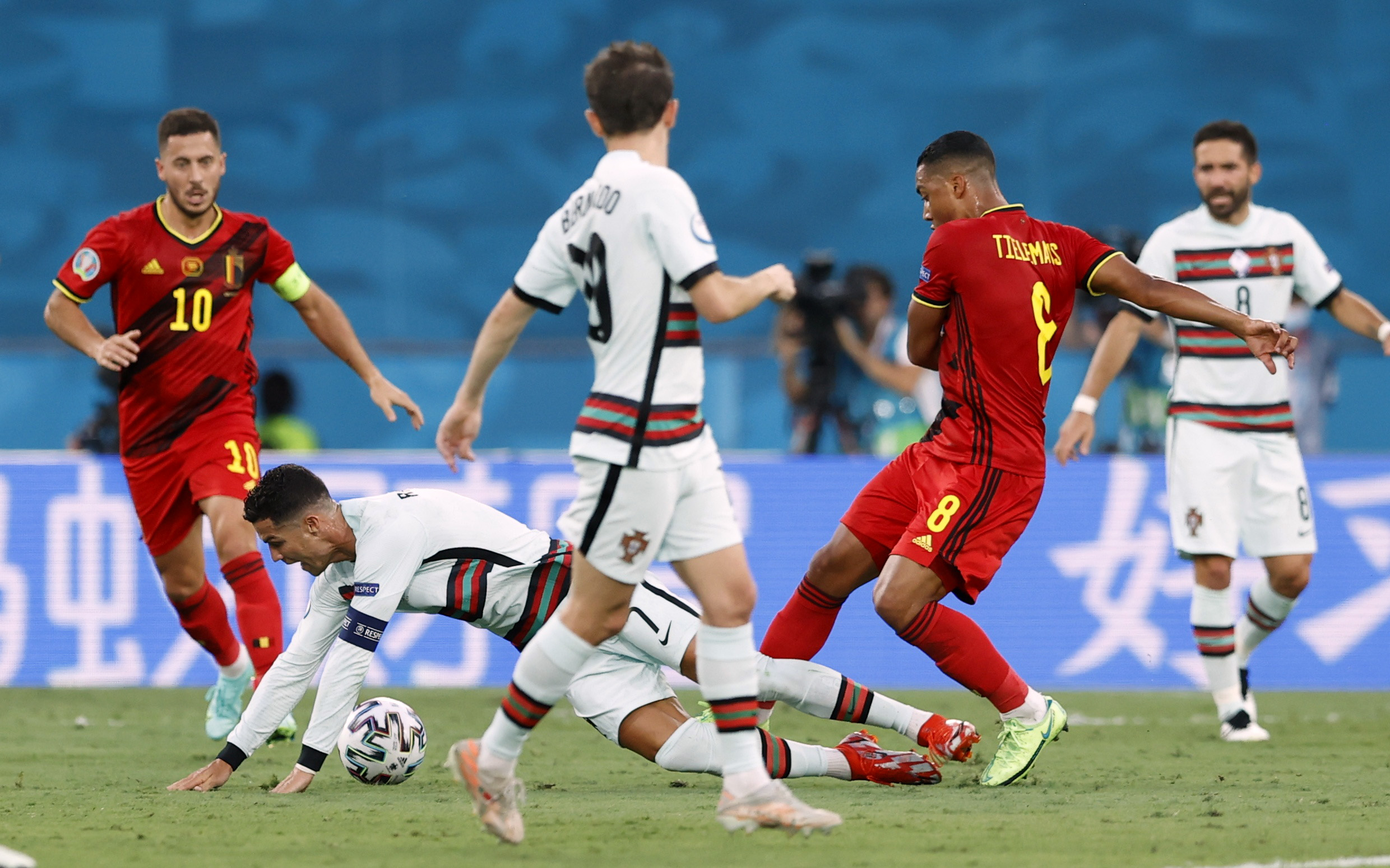 Soccer Football - Euro 2020 - Round of 16 - Belgium v Portugal - La Cartuja Stadium, Seville, Spain - June 27, 2021 Portugal's Cristiano Ronaldo in action with Belgium's Youri Tielemans Pool via REUTERS