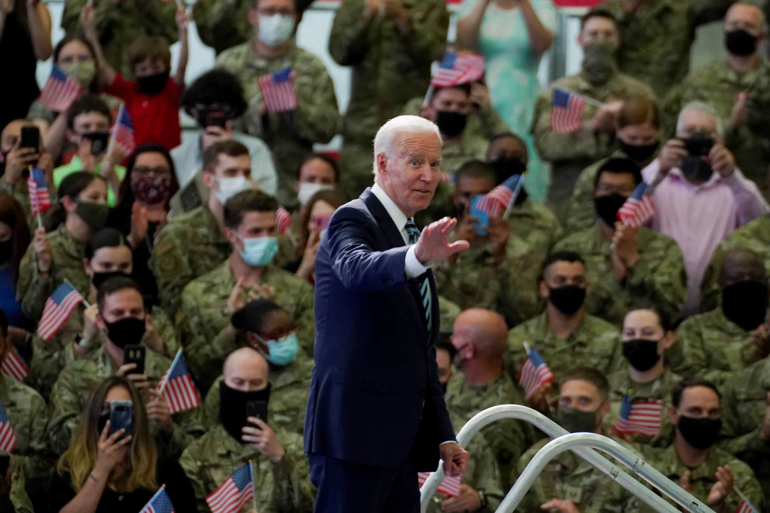 U.S. President Joe Biden gestures, as he stands next to U.S. Air Force personnel and their families stationed at  RAF Mildenhall, ahead of the G7 Summit, near Mildenhall, Britain June 9, 2021. REUTERS