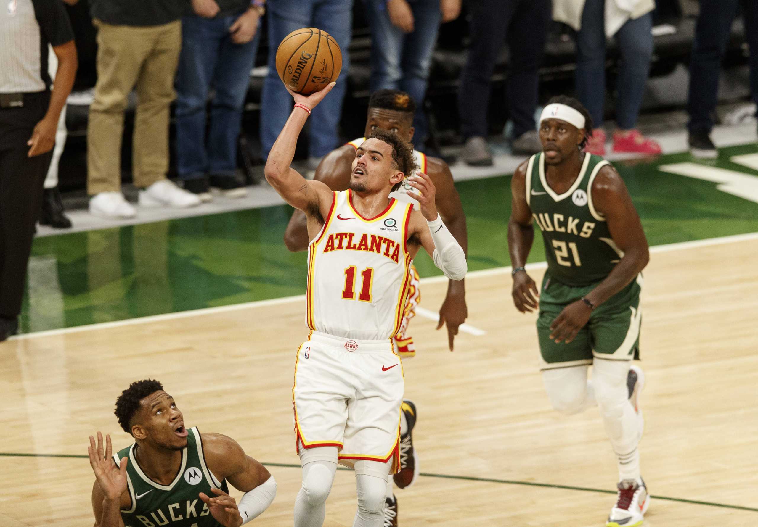 Jun 23, 2021; Milwaukee, Wisconsin, USA;  Atlanta Hawks guard Trae Young (11) shoots during the fourth quarter against the Milwaukee Bucks during game one of the Eastern Conference Finals for the 2021 NBA Playoffs at Fiserv Forum. Mandatory Credit: Jeff Hanisch-USA TODAY Sports