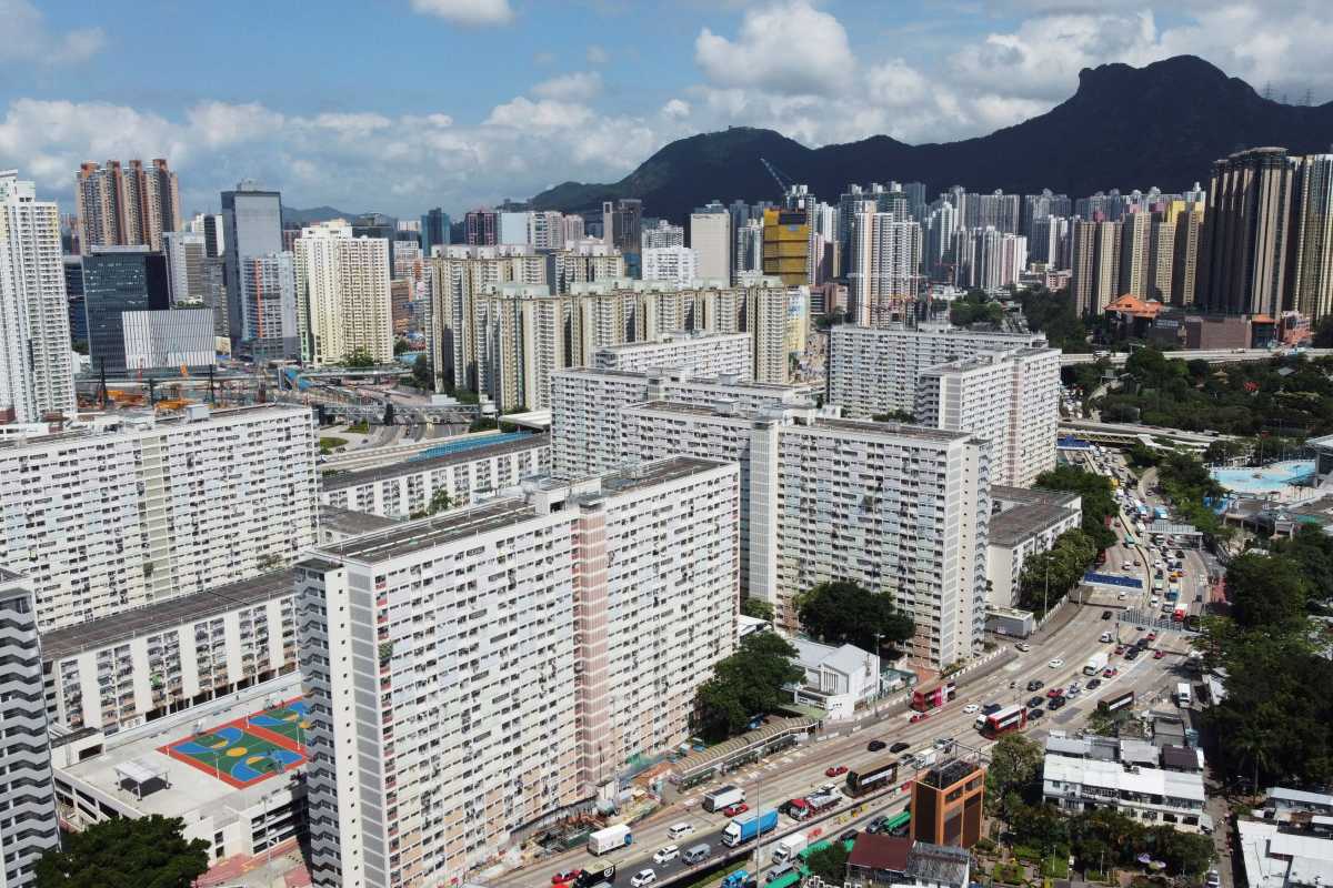 An aerial view shows Choi Hung public housing estate and other residential buildings with the Lion Rock peak in the background, in Hong Kong, China June 3, 2021. Picture taken June 3, 2021 with a drone. REUTERS