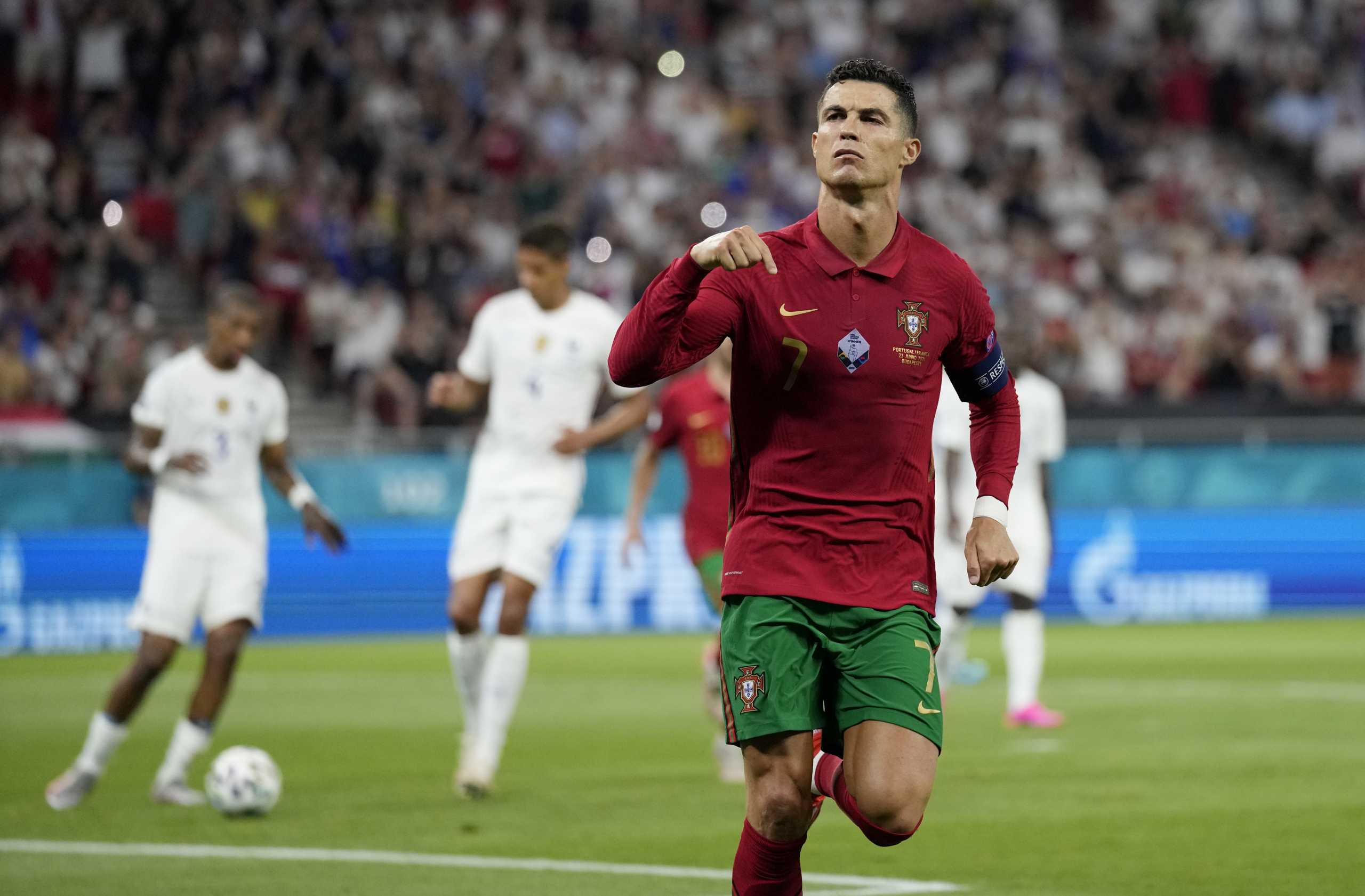 Soccer Football - Euro 2020 - Group F - Portugal v France - Puskas Arena, Budapest, Hungary - June 23, 2021 Portugal's Cristiano Ronaldo celebrates scoring their first goal Pool via REUTERS