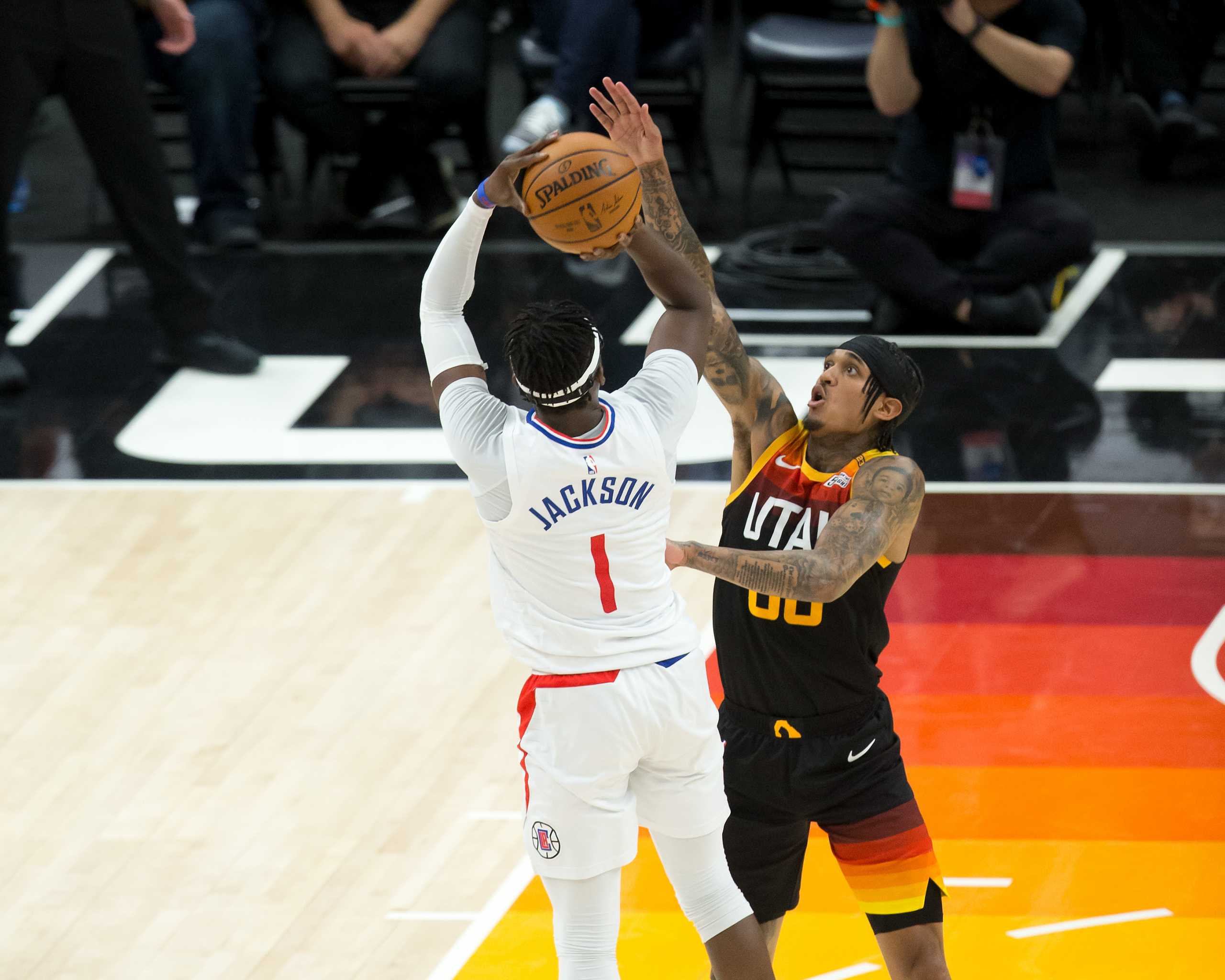 Jun 16, 2021; Salt Lake City, Utah, USA; LA Clippers guard Reggie Jackson (1) shoots the ball against Utah Jazz guard Jordan Clarkson (00) during the second half of game five of the second round of the 2021 NBA Playoffs at Vivint Arena. Mandatory Credit: Russell Isabella-USA TODAY Sports