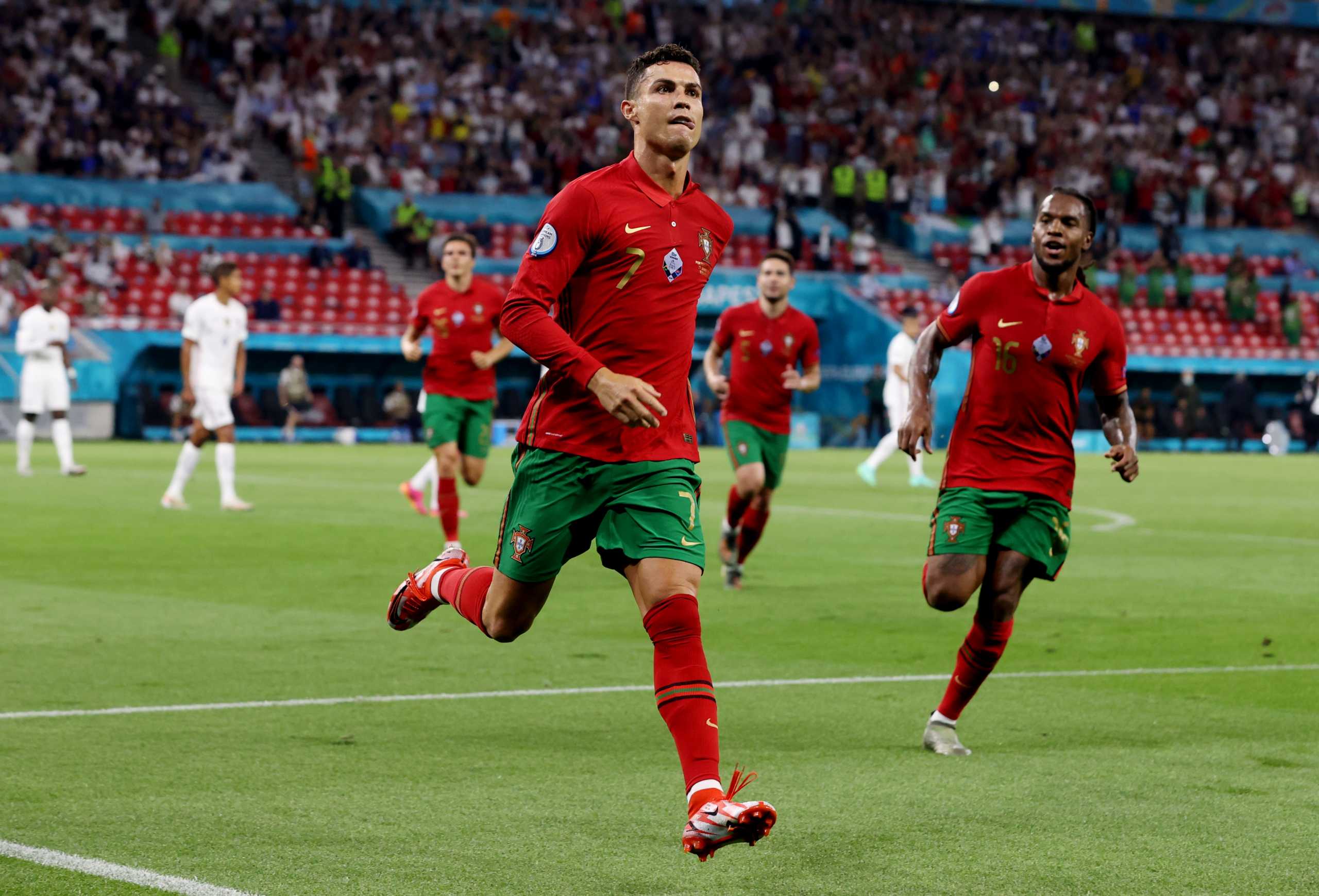 Soccer Football - Euro 2020 - Group F - Portugal v France - Puskas Arena, Budapest, Hungary - June 23, 2021 Portugal's Cristiano Ronaldo celebrates scoring their second goal with Renato Sanches Pool via REUTERS