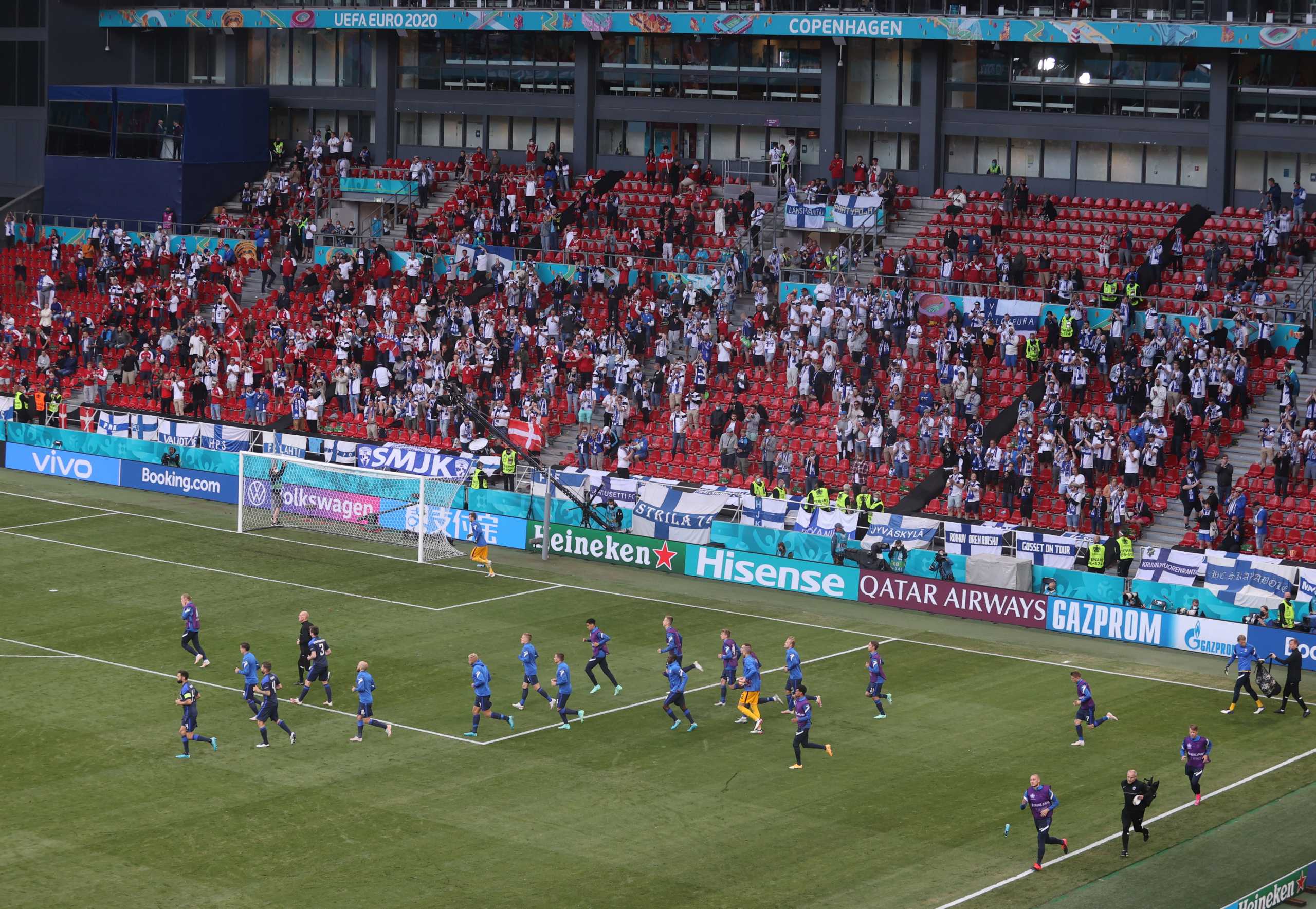 Soccer Football - Euro 2020 - Group B - Denmark v Finland - Parken Stadium, Copenhagen, Denmark - June 12, 2021 General view as Finland players come back out on to the pitch before the match is restarted Pool via REUTERS