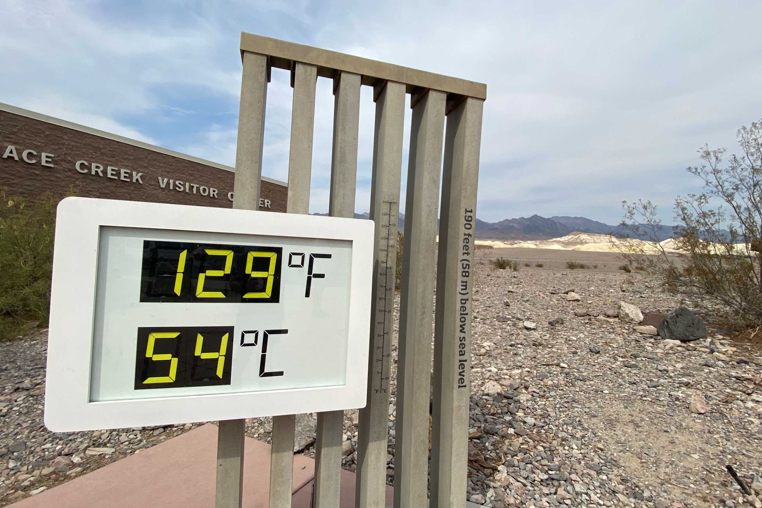The thermometer at the Furnace Creek Visitor Center at Death Valley National Park shows temperatures reading 129 degrees Fahrenheit (53.8 C) in Death Valley, California, U.S. June 16, 2021. Picture taken June 16, 2021.  REUTERS