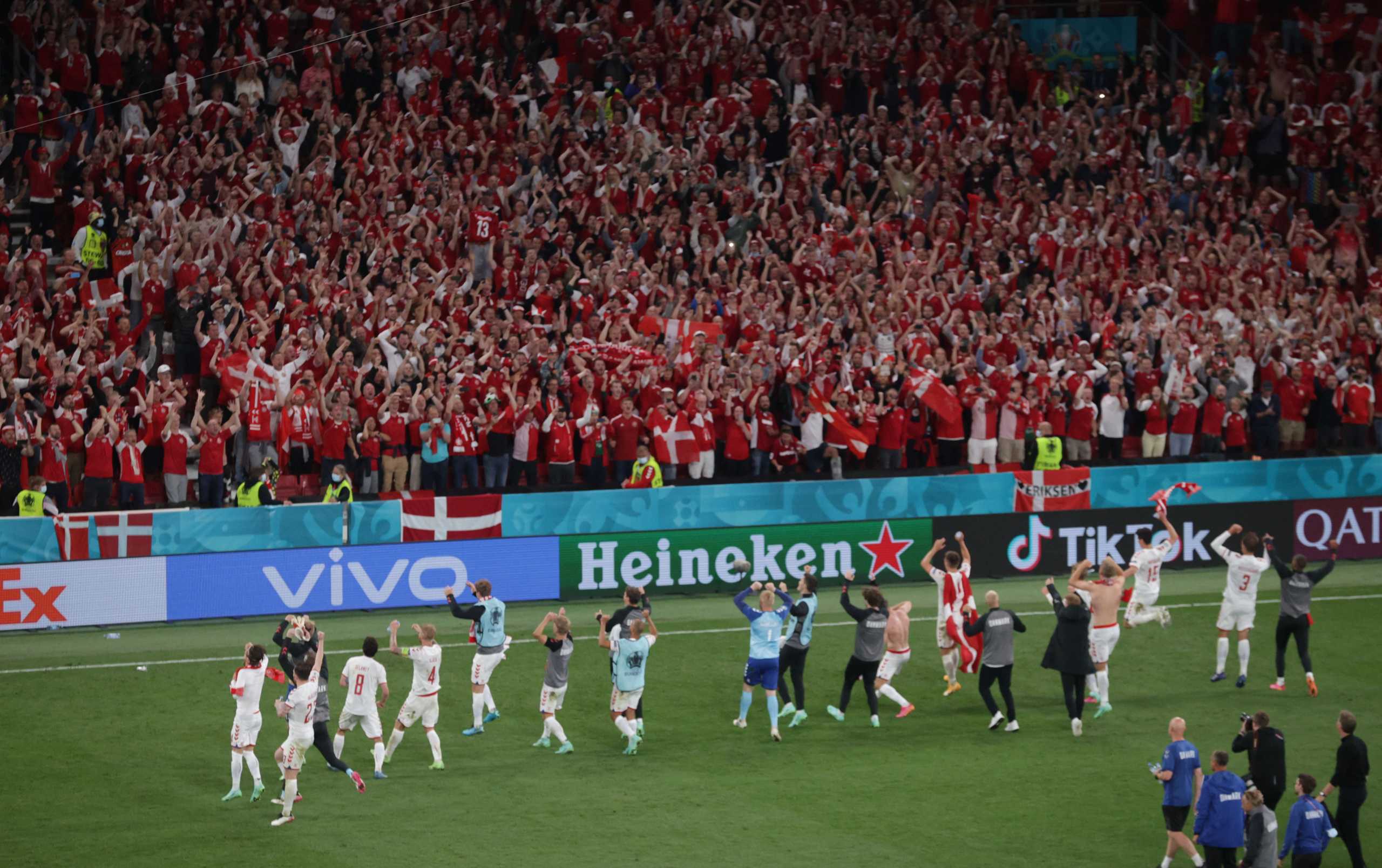 Soccer Football - Euro 2020 - Group B - Russia v Denmark - Parken Stadium, Copenhagen, Denmark - June 21, 2021 Denmark players celebrate with fans after the match Pool via REUTERS