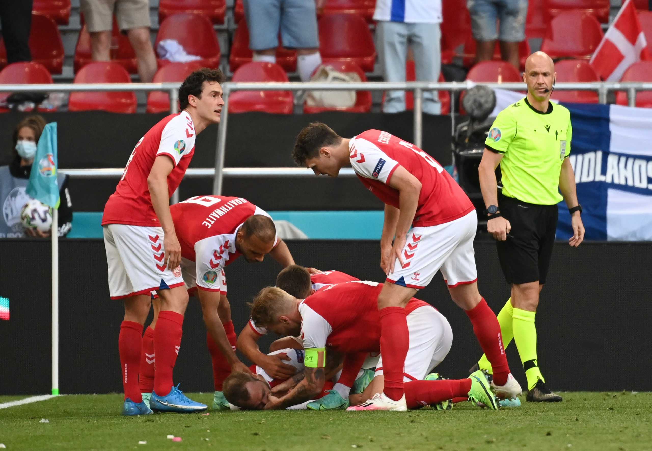 Soccer Football - Euro 2020 - Group B - Denmark v Finland - Parken Stadium, Copenhagen, Denmark - June 12, 2021 Denmark's Christian Eriksen receives medical attention after collapsing during the match Pool via REUTERS