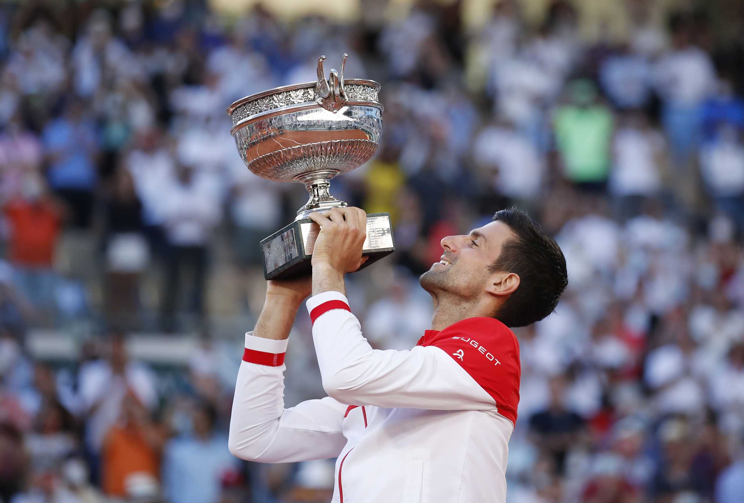 Tennis - French Open - Roland Garros, Paris, France - June 13, 2021 Serbia's Novak Djokovic celebrates with the trophy after winning the French Open against Greece's Stefanos Tsitsipas REUTERS
