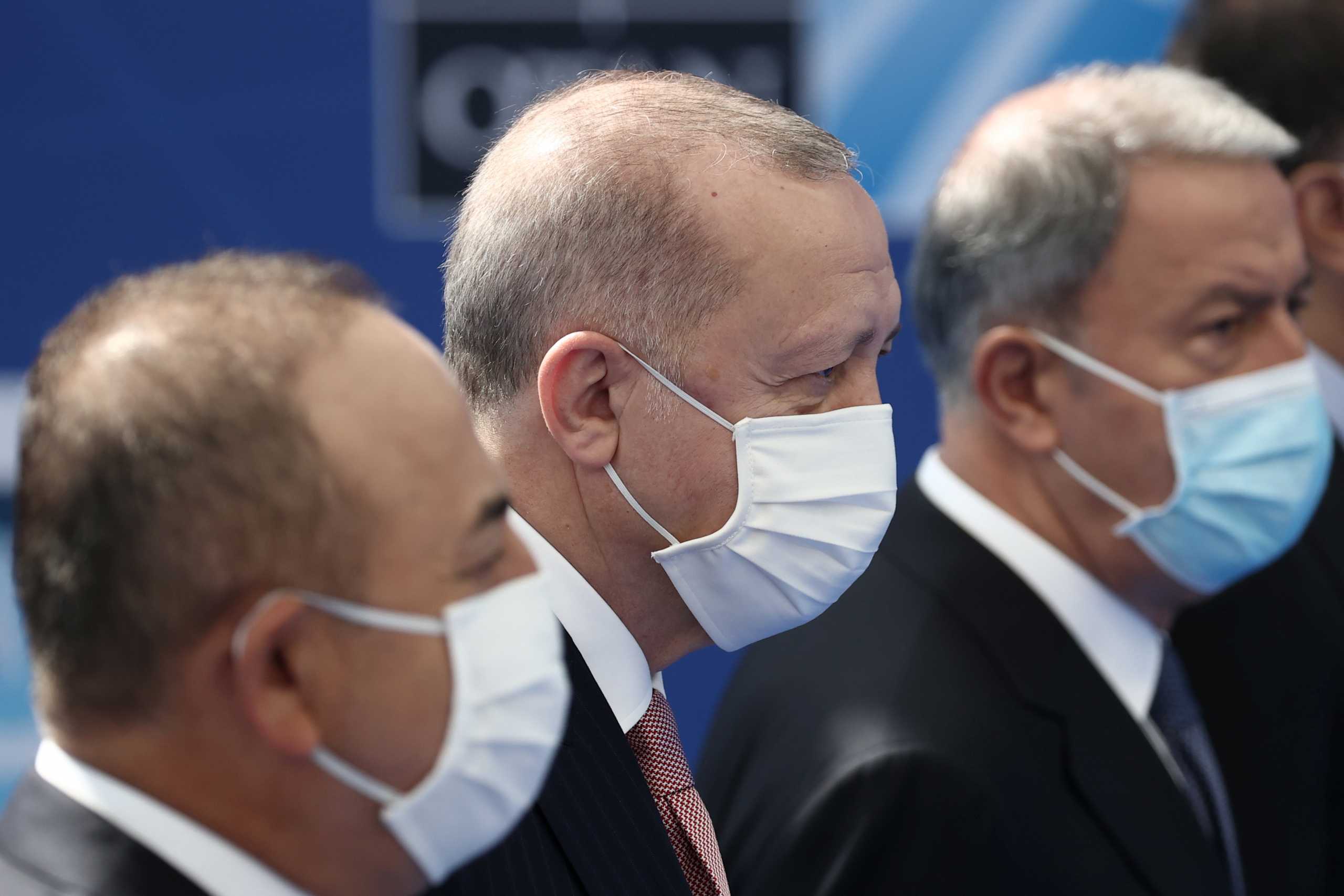 Turkey's President Tayyip Erdogan and Foreign Minister Mevlut Cavusoglu arrive for the NATO summit at the Alliance's headquarters, in Brussels, Belgium, June 14, 2021. Kenzo Tribouillard