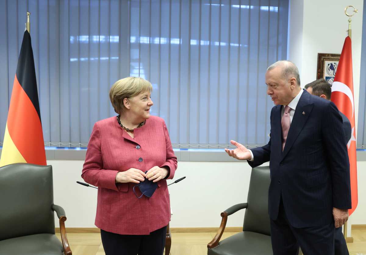 Turkish President Tayyip Erdogan meets with Germany's Chancellor Angela Merkel on the sidelines of the NATO summit, in Brussels, Belgium June 14, 2021. Presidential Press Office