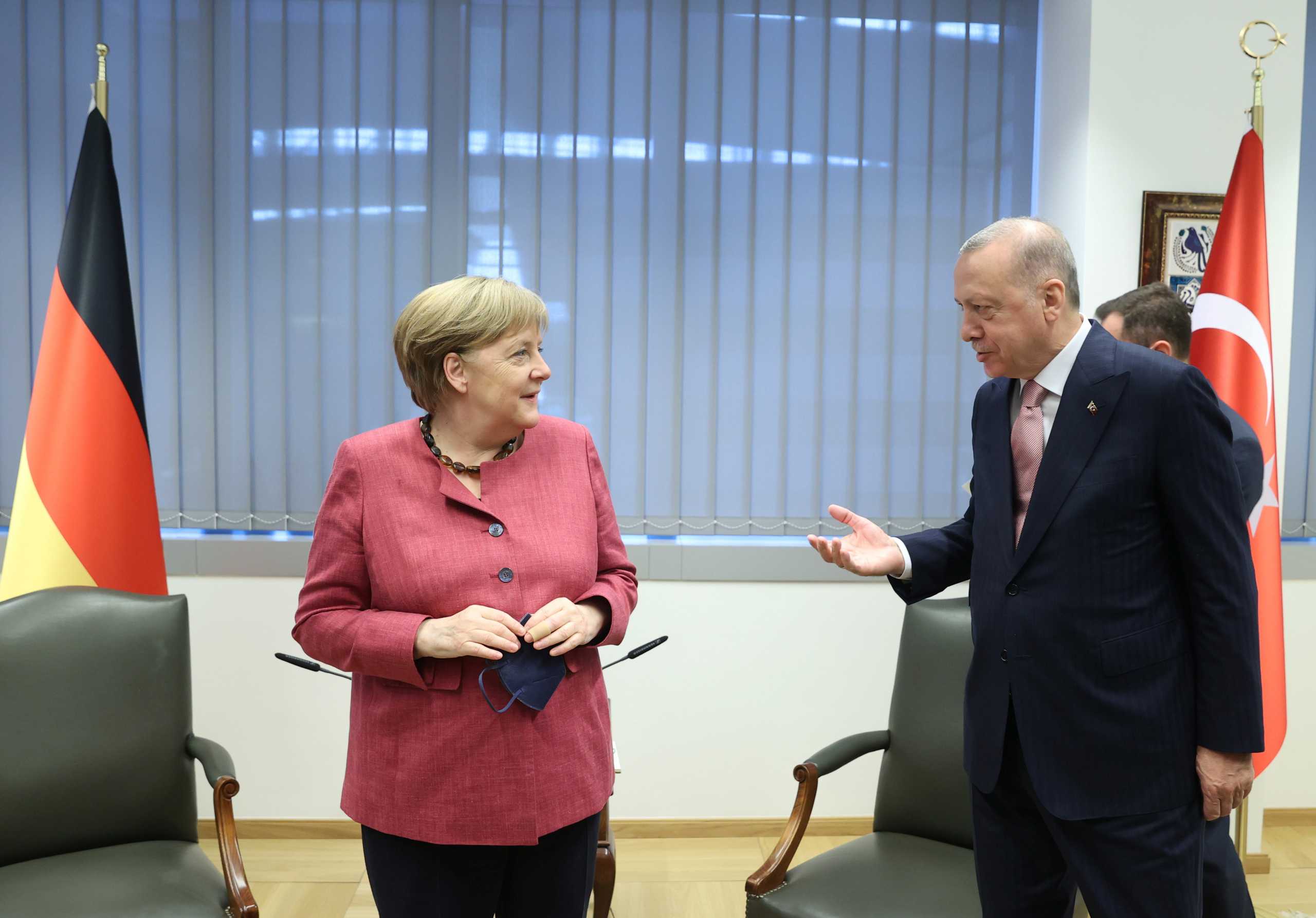 Turkish President Tayyip Erdogan meets with Germany's Chancellor Angela Merkel on the sidelines of the NATO summit, in Brussels, Belgium June 14, 2021. Presidential Press Office