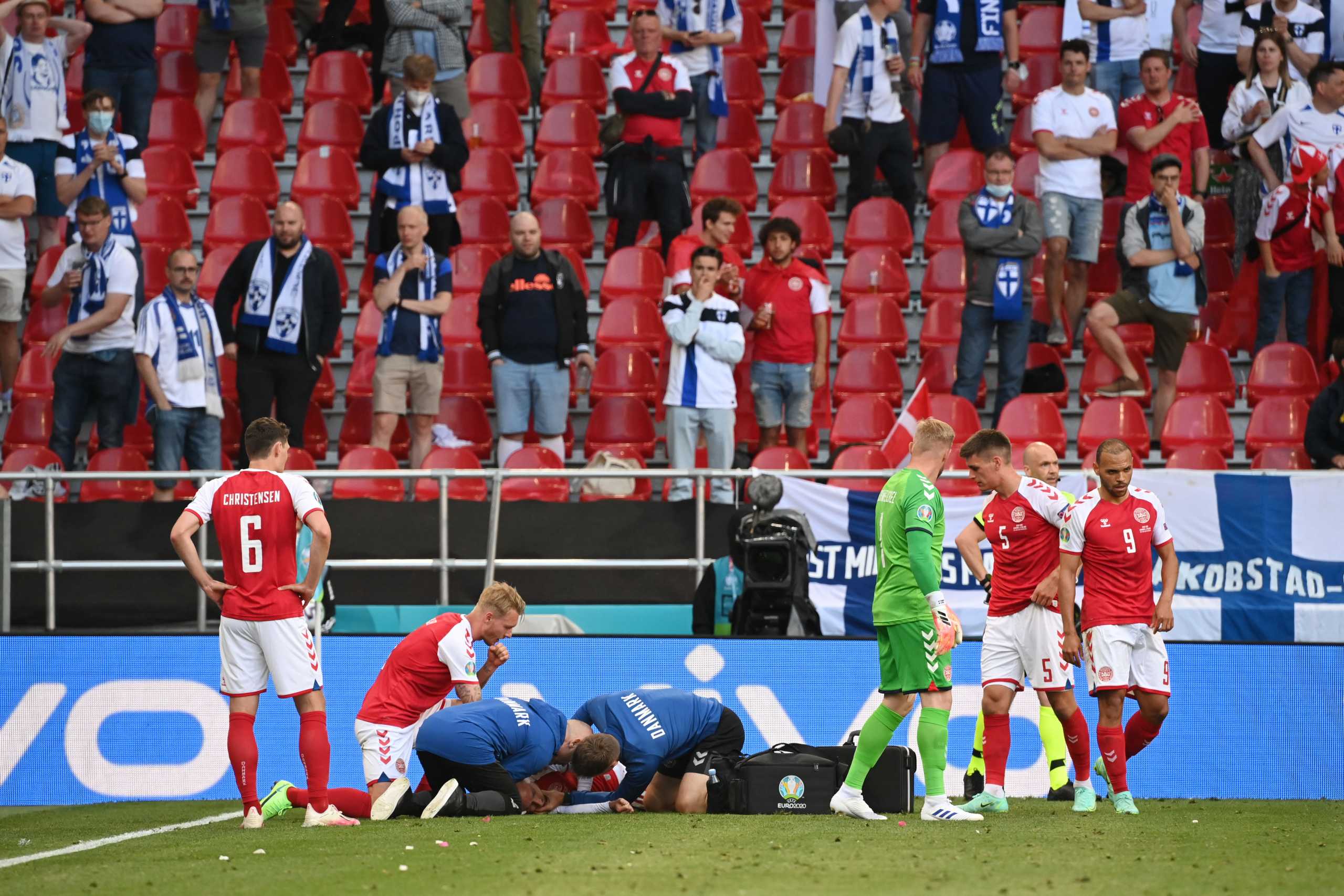 Soccer Football - Euro 2020 - Group B - Denmark v Finland - Parken Stadium, Copenhagen, Denmark - June 12, 2021 Denmark's Christian Eriksen receives medical attention after collapsing during the match Pool via REUTERS