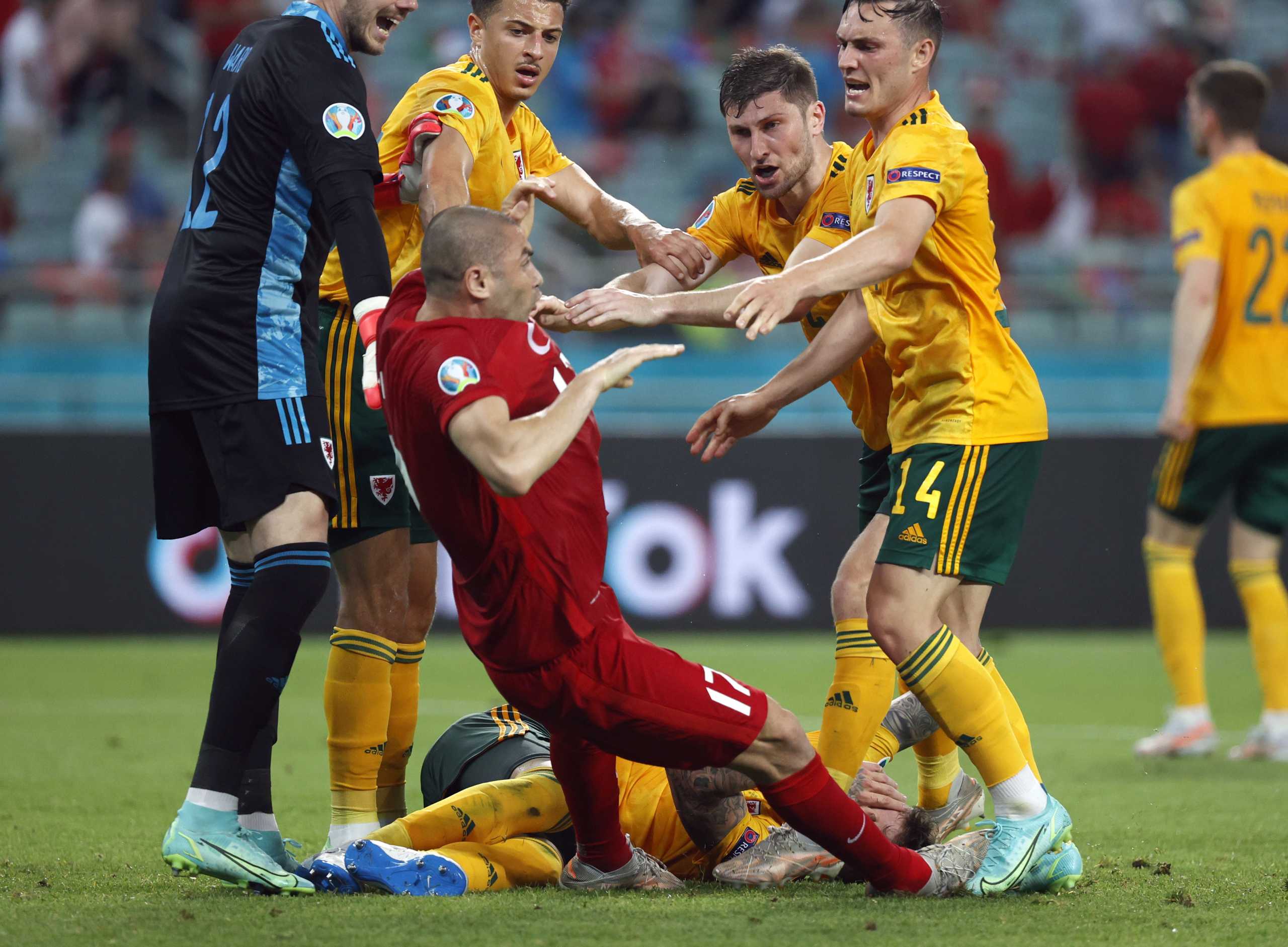 Soccer Football - Euro 2020 - Group A - Turkey v Wales - Baku Olympic Stadium, Baku, Azerbaijan - June 16, 2021 Wales' Connor Roberts and Ben Davies clash with Turkey's Burak Yilmaz as Wales' Danny Ward and Ethan Ampadu look on Pool via REUTERS