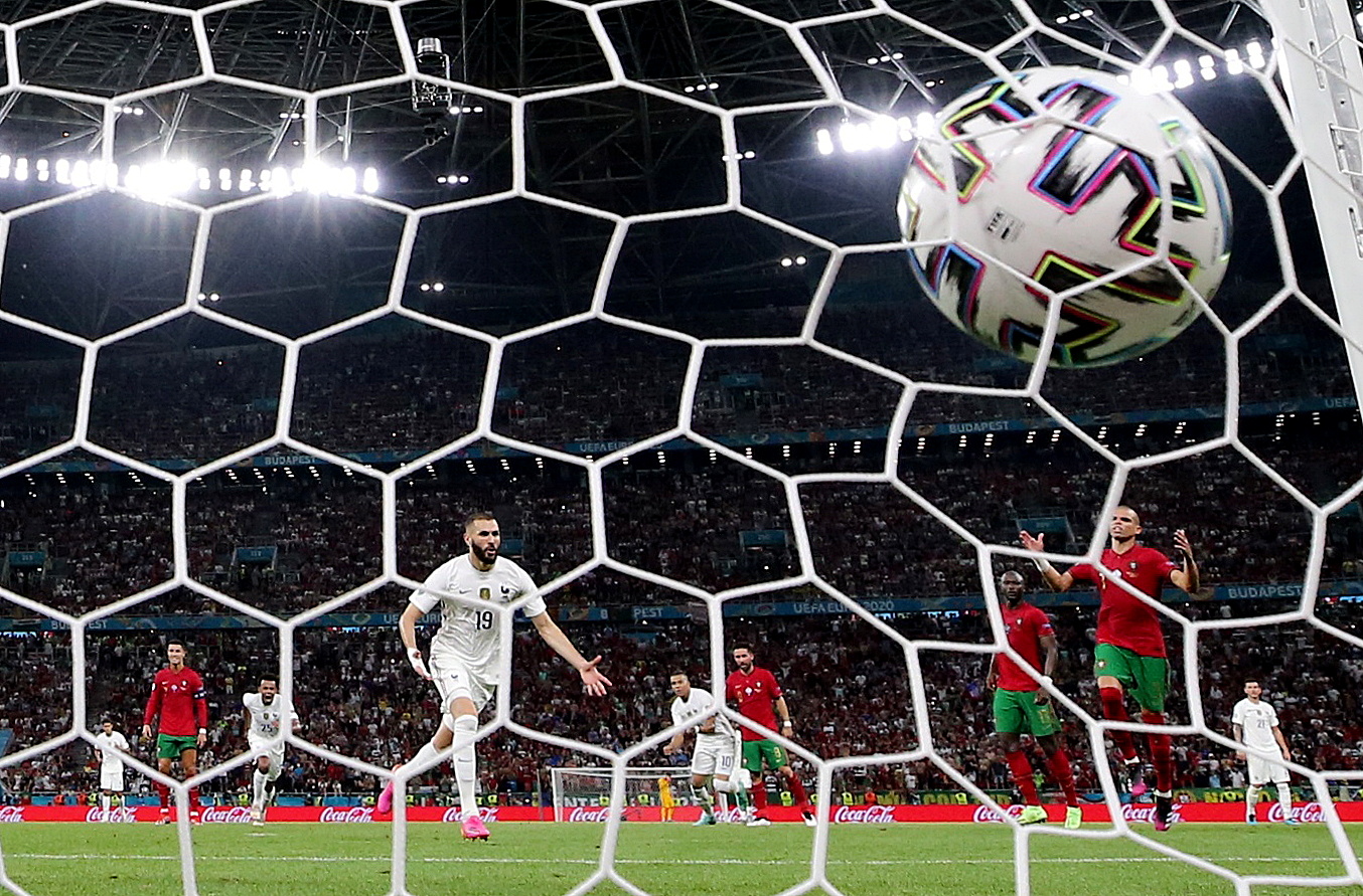 Soccer Football - Euro 2020 - Group F - Portugal v France - Puskas Arena, Budapest, Hungary - June 23, 2021 France's Karim Benzema celebrates scoring their first goal as Portugal's Pepe reacts REUTERS