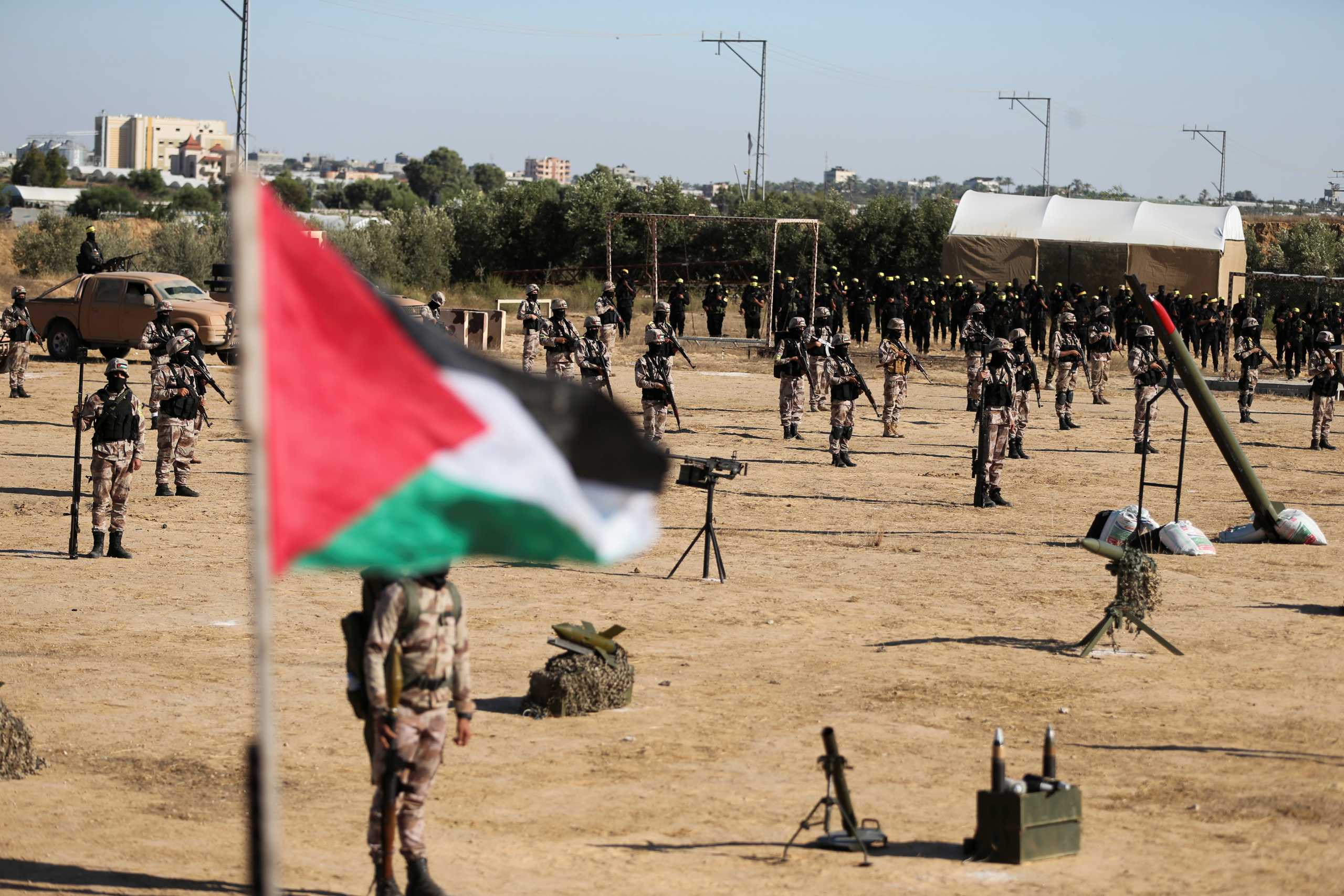 Palestinian Fatah militants hold an anti-Israel rally in Khan Younis, in the southern Gaza Strip June 7, 2021. REUTERS