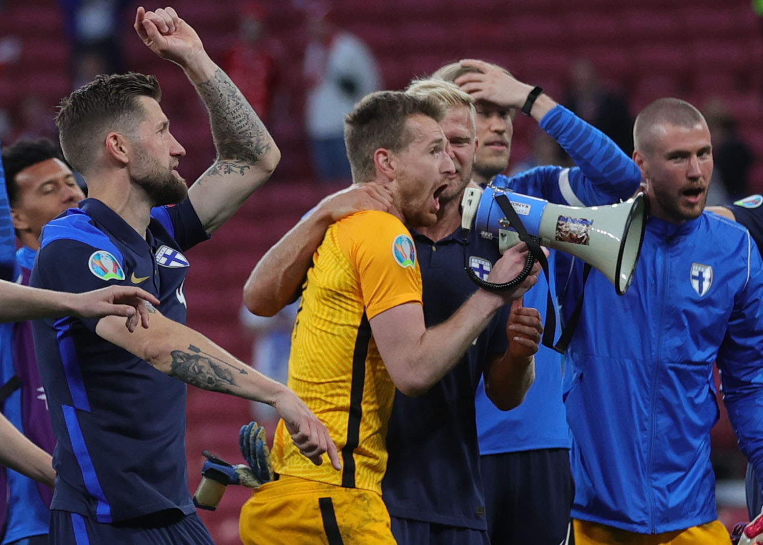 Soccer Football - Euro 2020 - Group B - Denmark v Finland - Parken Stadium, Copenhagen, Denmark - June 12, 2021 Finland's Lukas Hradecky celebrate after the match with teammates Pool via REUTERS