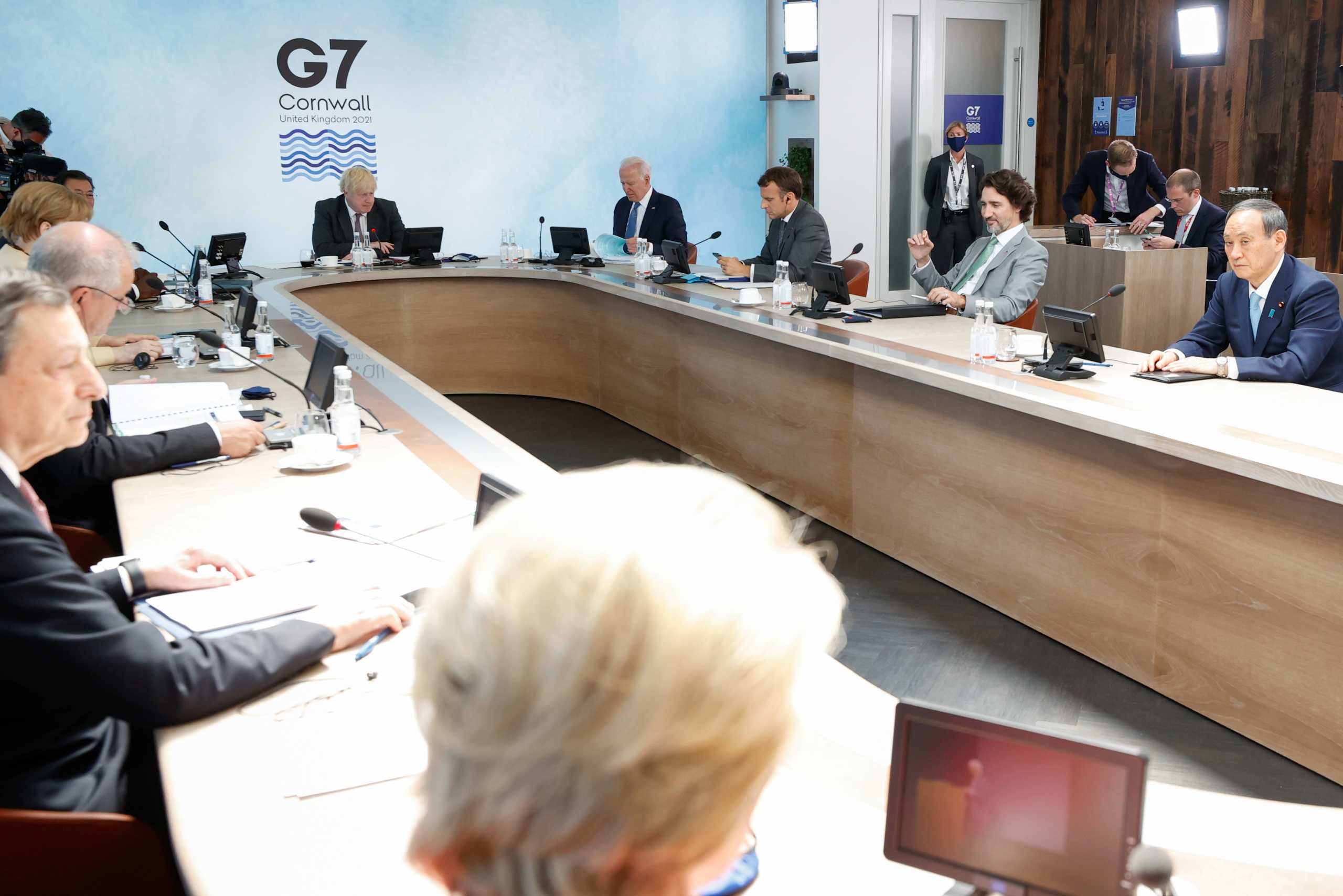 Italy's Prime Minister Mario Draghi, German Chancellor Angela Merkel, Britain's Prime Minister Boris Johnson, U.S. President Joe Biden, France's President Emmanuel Macron, Canada's Prime Minister Justin Trudeau and Japan's Prime Minister Yoshihide Suga attend a plenary session during G7 summit in Carbis Bay, Cornwall, Britain, June 13, 2021. REUTERS