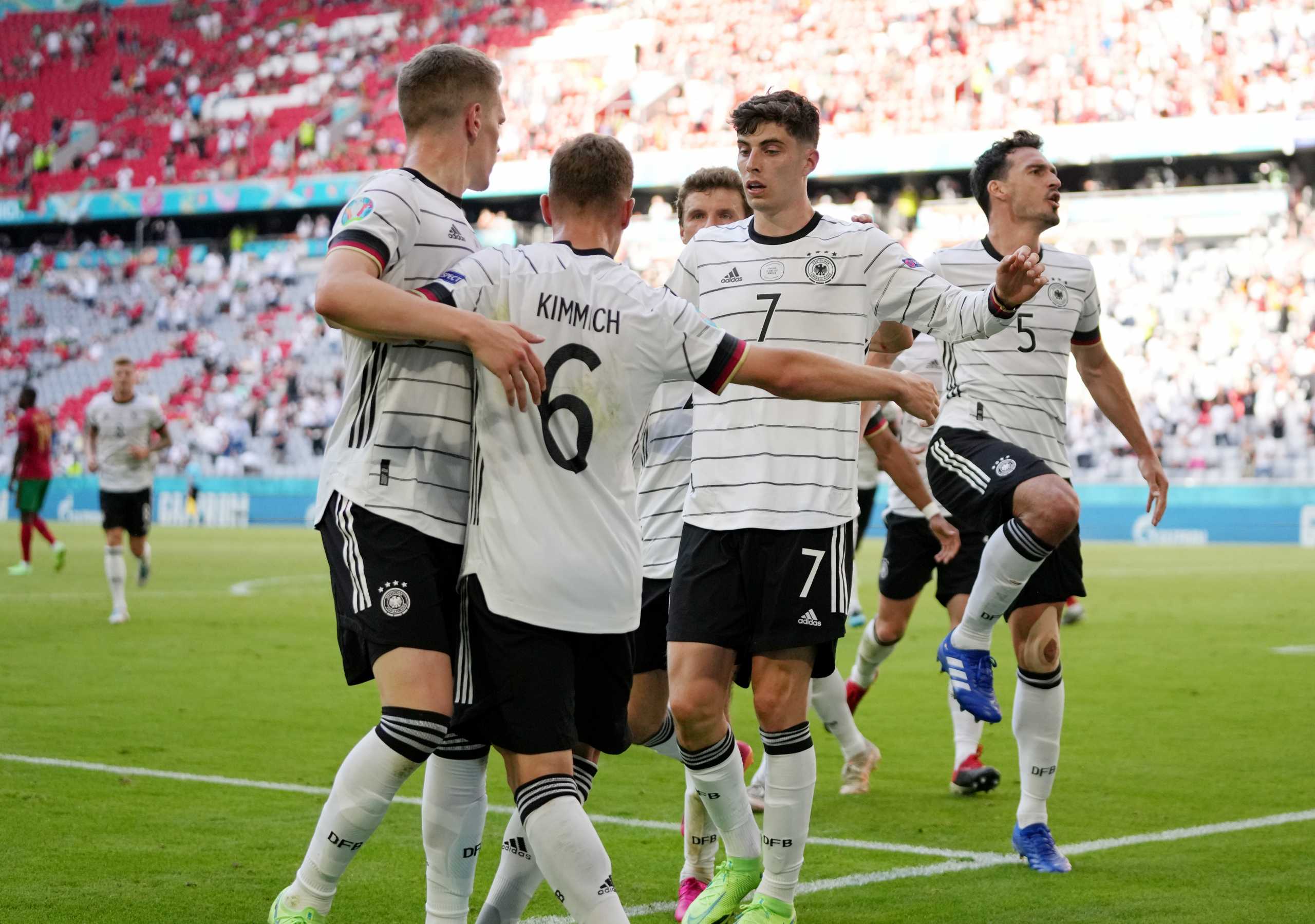 Soccer Football - Euro 2020 - Group F - Portugal v Germany - Football Arena Munich, Munich, Germany - June 19, 2021  Germany's Kai Havertz with teammates celebrates their second goal, an own goal scored by Portugal's Raphael Guerreiro Pool via REUTERS