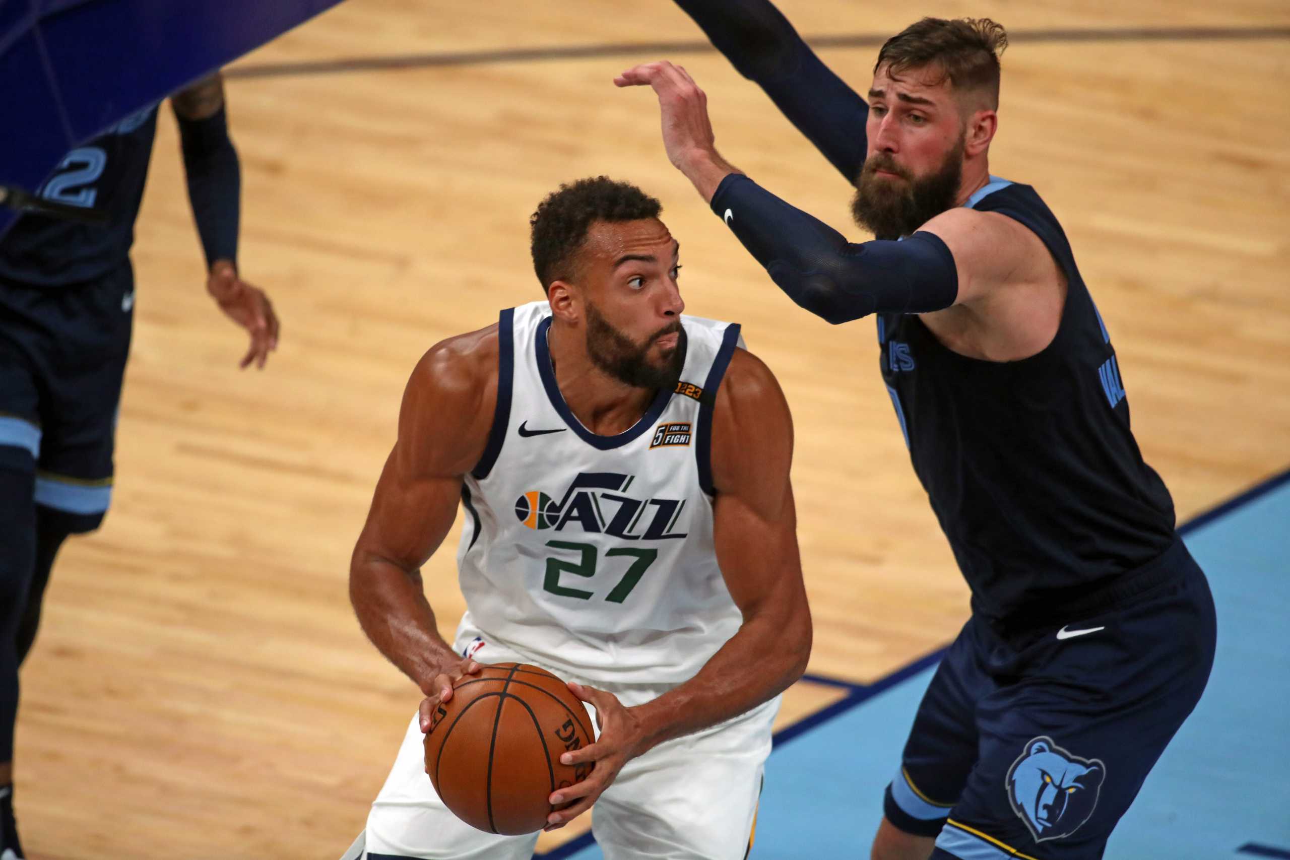 May 31, 2021; Memphis, Tennessee, USA; Utah Jazz center Rudy Gobert (27) drives to the basket as Memphis Grizzlies center Jonas Valančiūnas (17) defends during the fourth quarter during game four in the first round of the 2021 NBA Playoffs at FedExForum. Mandatory Credit: Petre Thomas-USA TODAY Sports