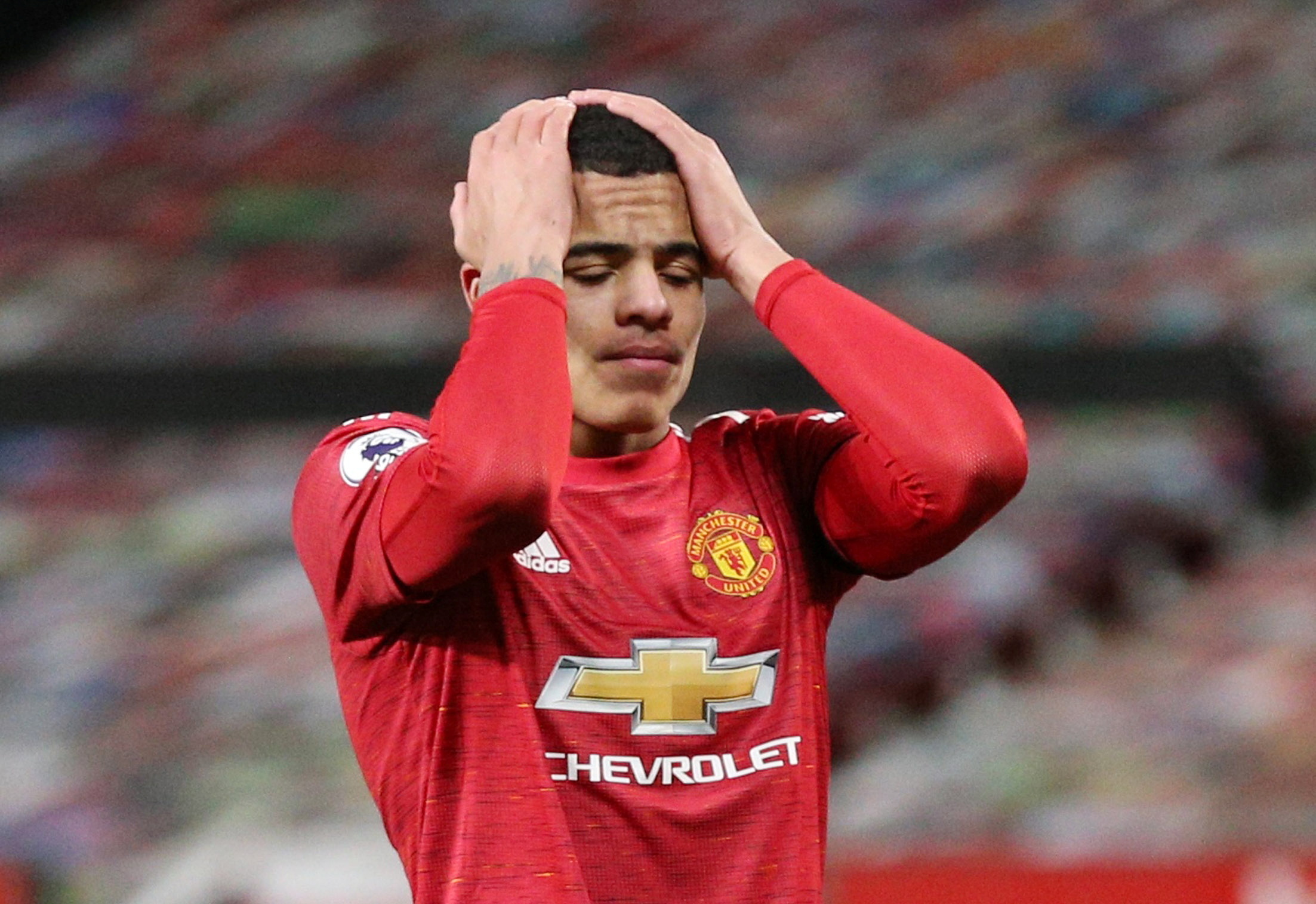 FILE PHOTO: Soccer Football - Premier League - Manchester United v Everton - Old Trafford, Manchester, Britain - February 6, 2021 Manchester United's Mason Greenwood reacts Pool via REUTERS