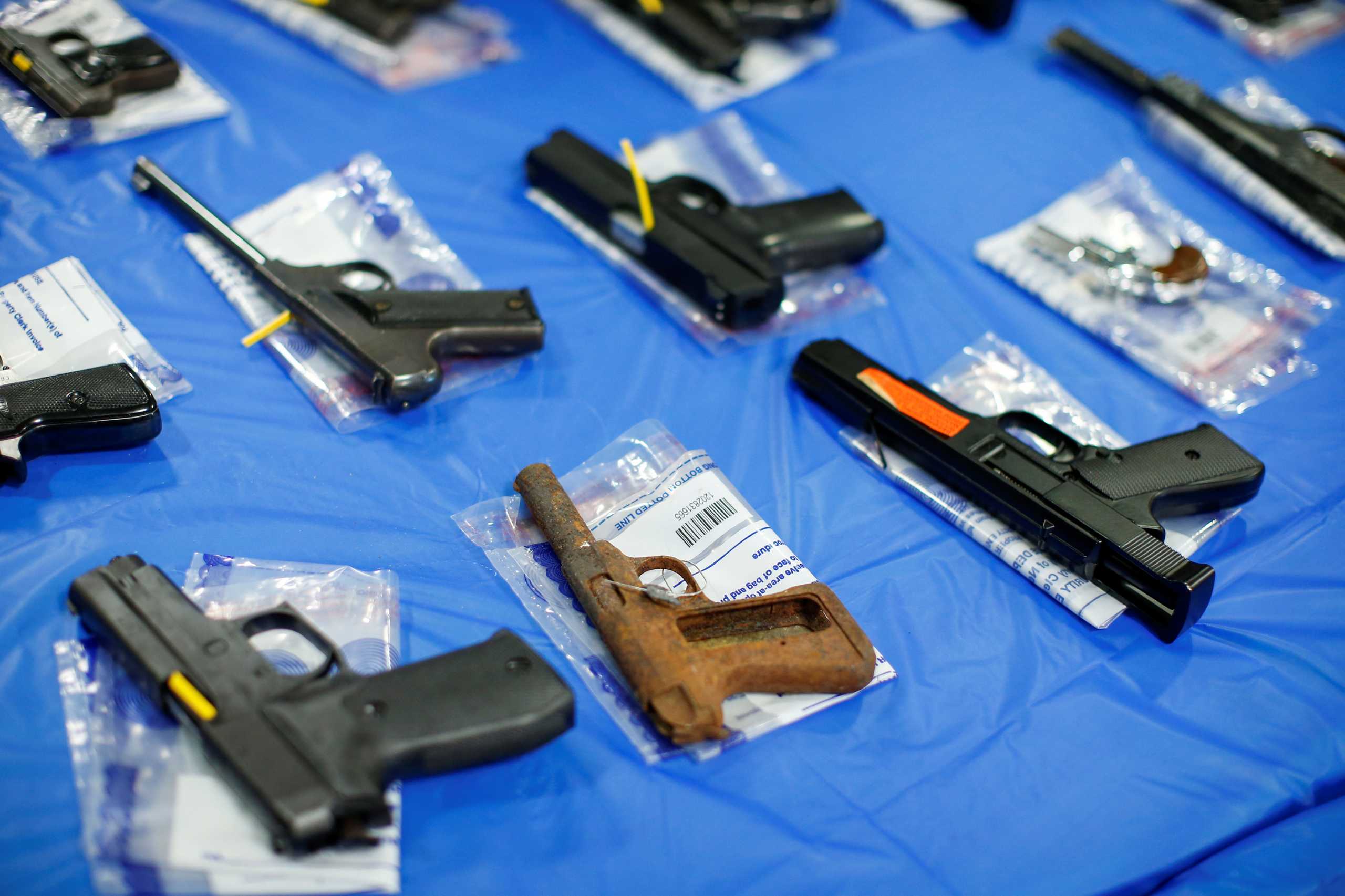 Pistols are displayed after a gun buyback event organized by the New York City Police Department (NYPD), in the Queens borough of New York City, U.S., June 12, 2021. REUTERS