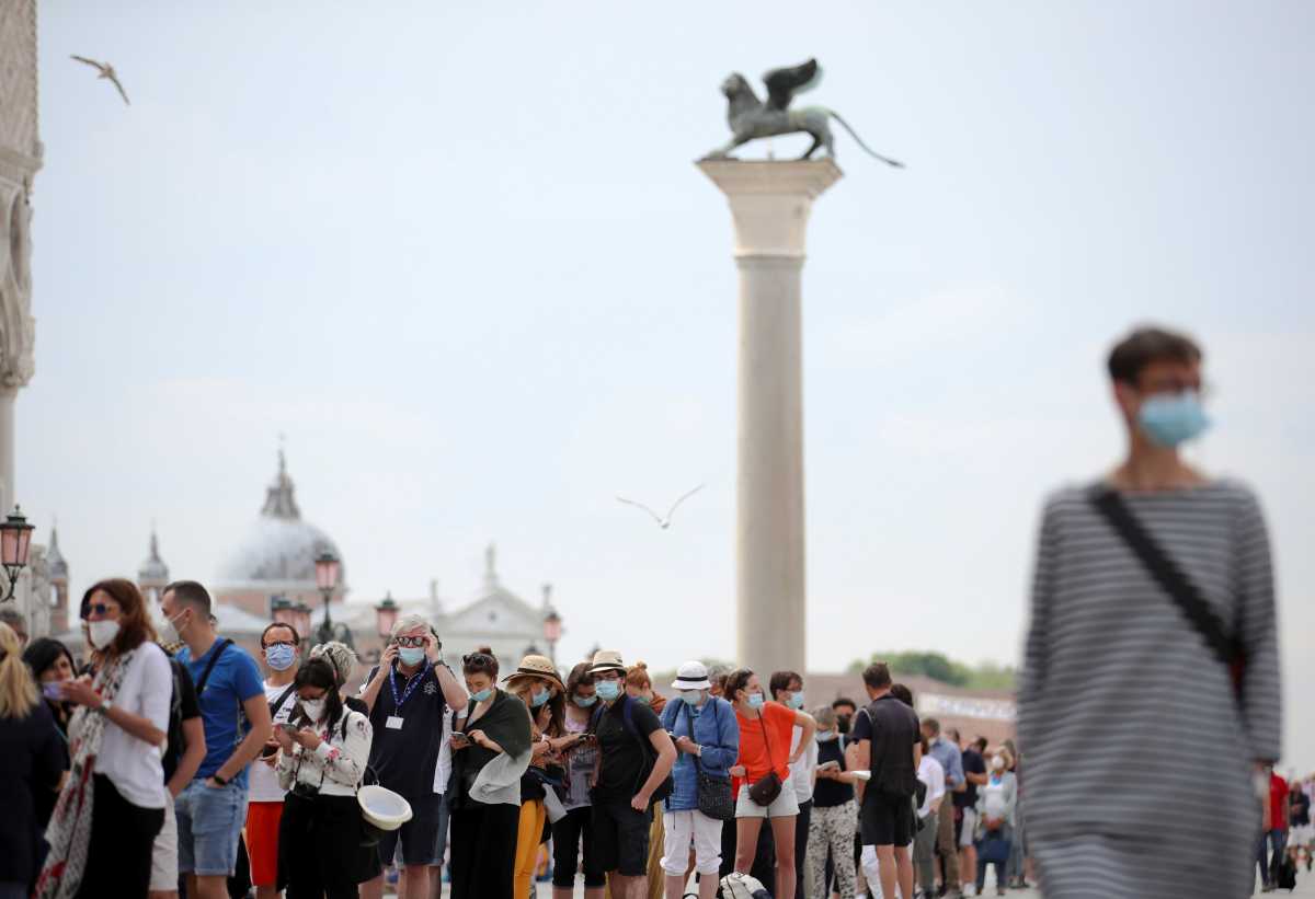 People queue to enter San Marco Dome, as the region of Veneto becomes a "white zone", following a relaxation of coronavirus disease (COVID-19) restrictions with only masks and social distancing required, in Venice, Italy, June 7, 2021. REUTERS