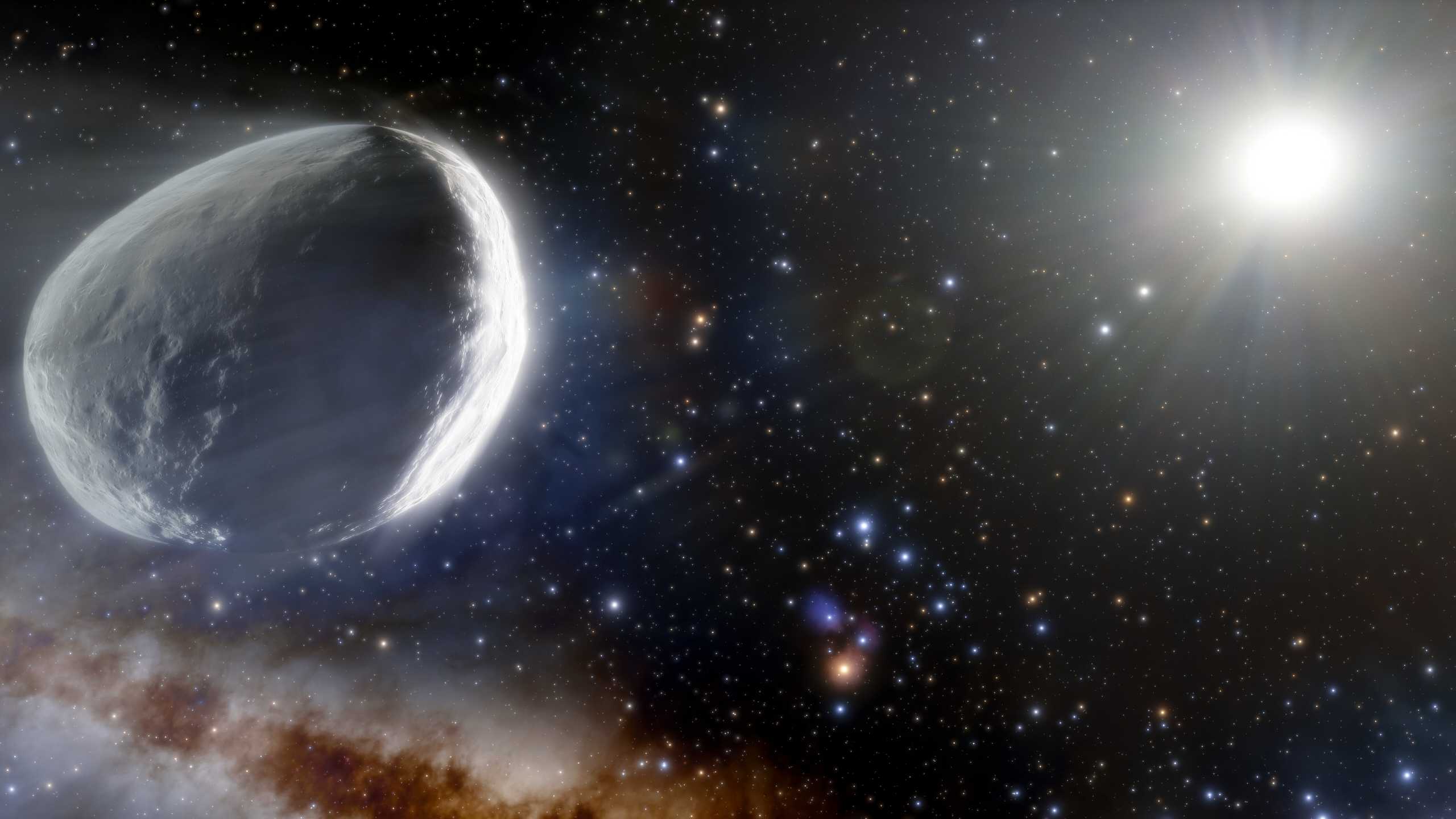 This illustration shows the distant Comet Bernardinelli-Bernstein as it might look in the outer Solar System. Comet Bernardinelli-Bernstein is estimated to be about 1000 times more massive than a typical comet, making it arguably the largest comet discovered in modern times. It has an extremely elongated orbit, journeying inward from the distant Oort Cloud over millions of years. It is the most distant comet to be discovered on its incoming path.