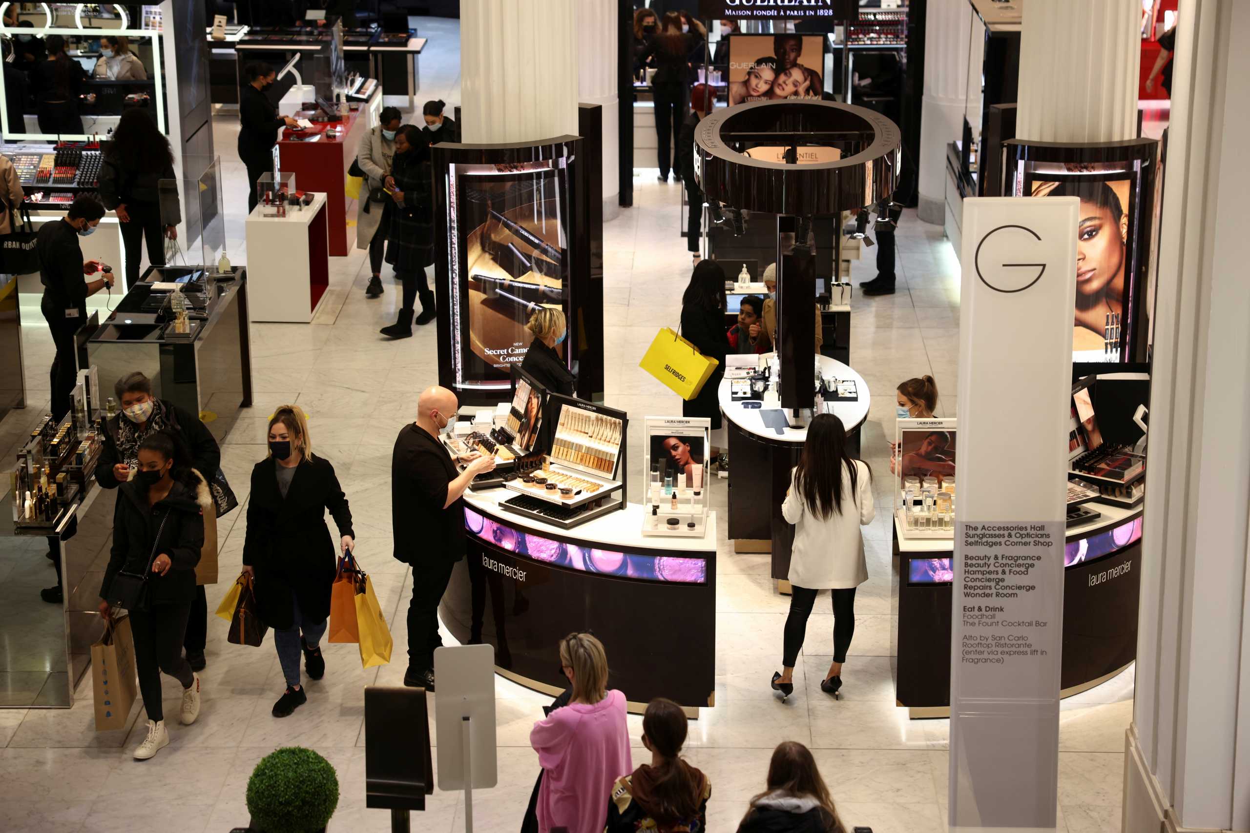 FILE PHOTO: People shop in the Selfridges department store on Oxford street, as the coronavirus disease (COVID-19) restrictions ease, in London, Britain April 12, 2021. REUTERS