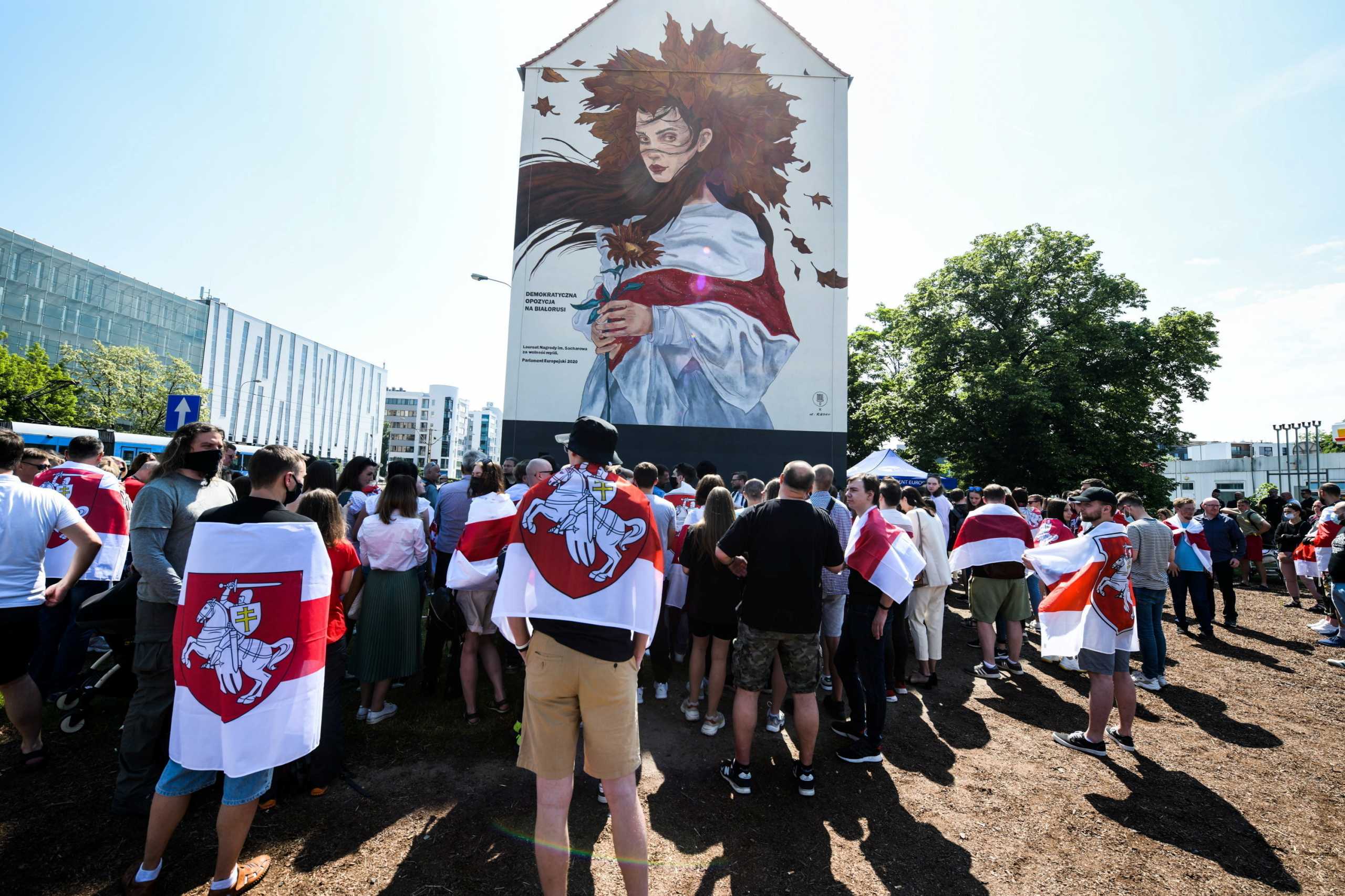 People attend unveil of a mural in solidarity with detained Belarusian journalist Roman Protasevich and his family, in Wroclaw, Poland June 5, 2021. Tomasz Pietrzyk