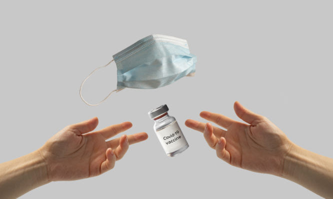 Coronavirus vaccination concept , hands reaching for vaccine dose, masks are off