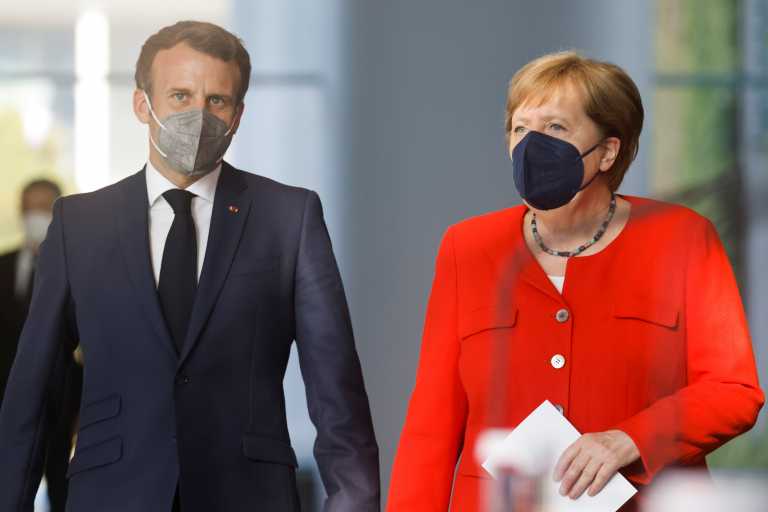 Emanuel Macron and Angela Merkel will work closely until a government emerges in Germany