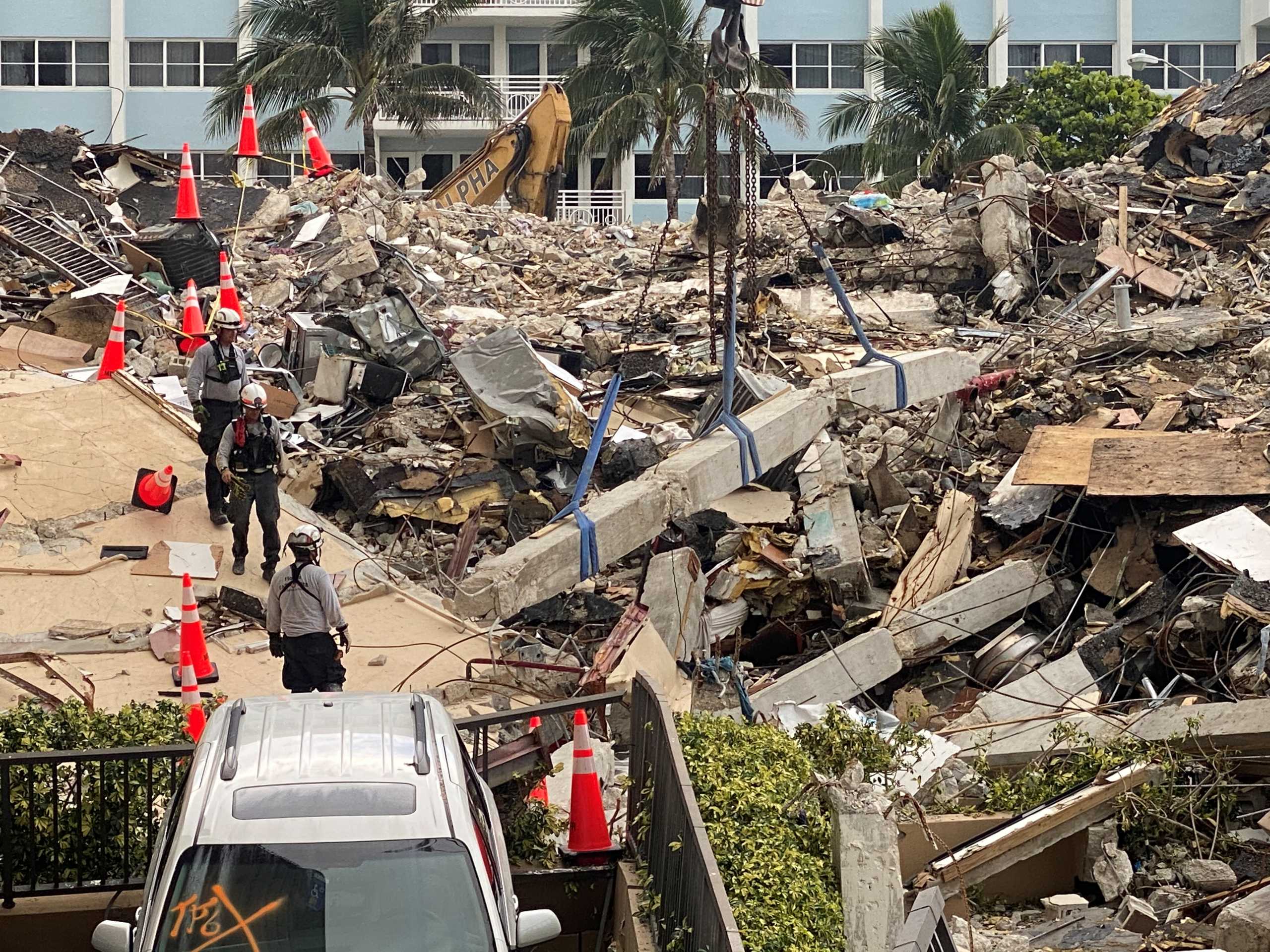 Members of the Urban Search and Rescue Florida Task Force 3 heavy rigging team work at the site of a partially collapsed residential building in Surfside, near Miami Beach, Florida, June 28, 2021. Picture taken June 28, 2021. FLORIDA TASK FORCE 3