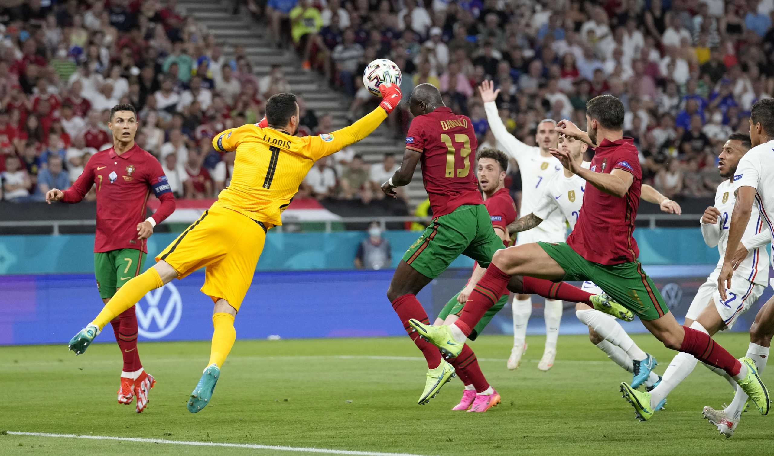 Soccer Football - Euro 2020 - Group F - Portugal v France - Puskas Arena, Budapest, Hungary - June 23, 2021 Portugal's Danilo Pereira is challenged by France's Hugo Lloris resulting in a penalty to Portugal Pool via REUTERS